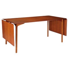 ‘GRAND PRIX’ - Extension dining table , teak & beech  by Arne Jacobsen