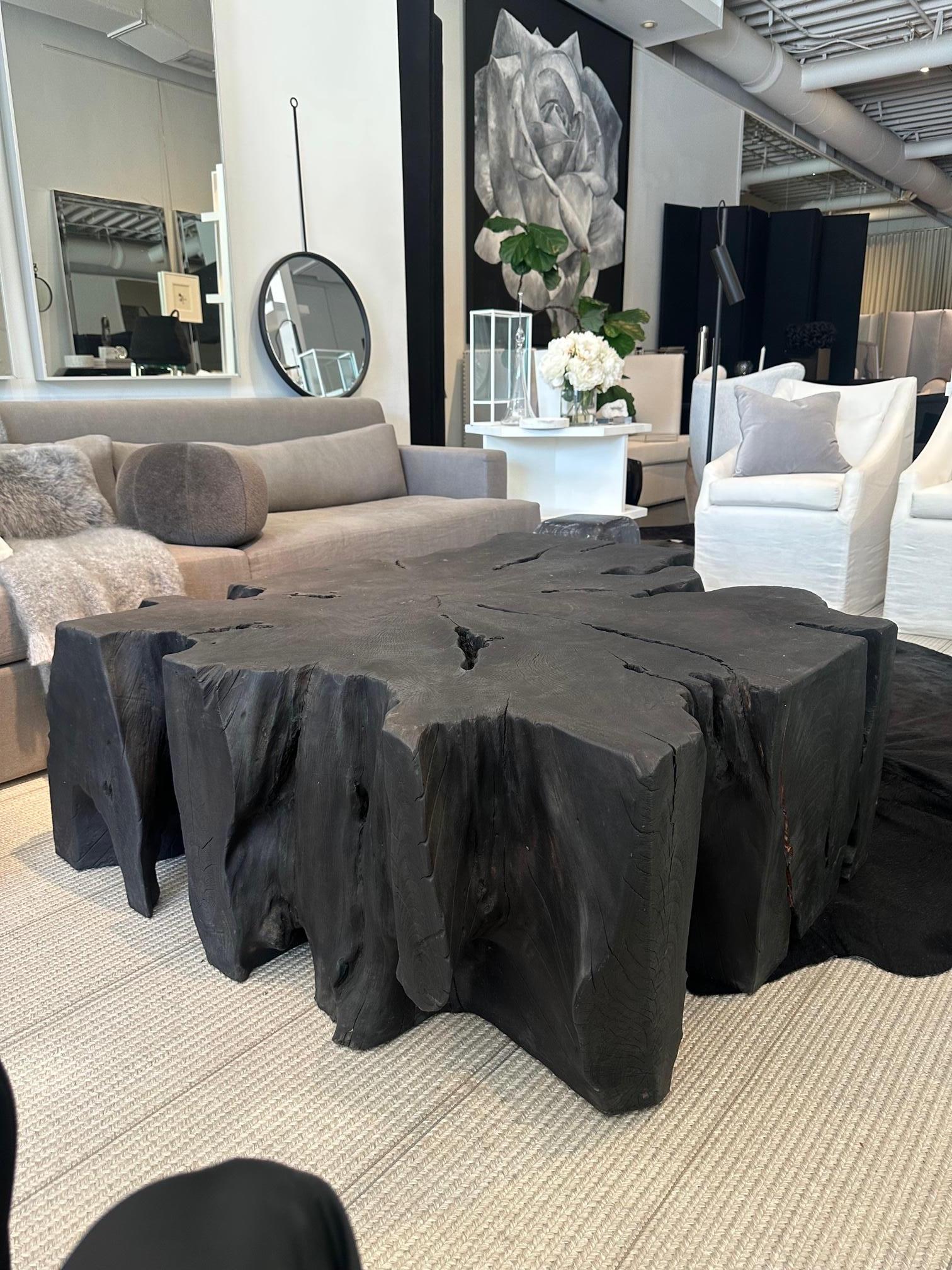 Spectacular Root Cocktail Table. Solid Wood with an unique organic shape, finished in Matte Black. On casters