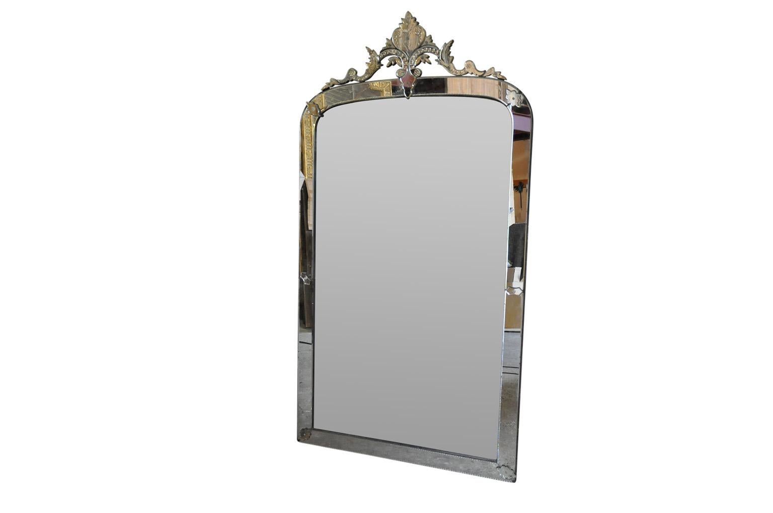 A stunning and grand scale 19th century Venetian mirror. Elegantly minimalist and very chic. A wonderful accent for any living area.