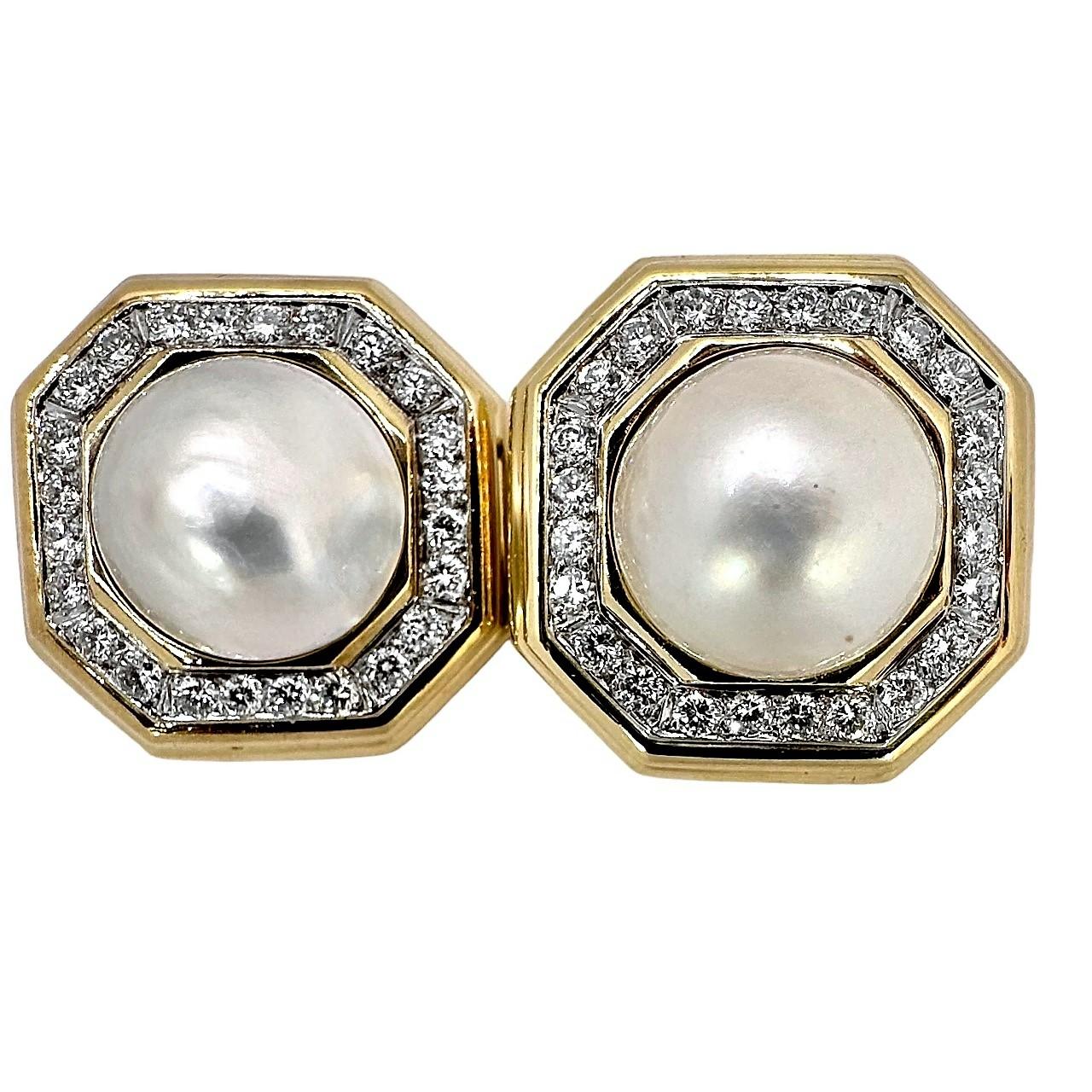This very impressive pair of 18k yellow gold and platinum earrings were created by French designer 