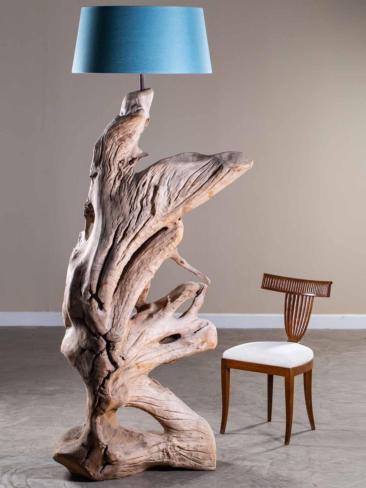 Incredible organic modern driftwood floor lamp of grand scale crafted entirely by nature. Harvested from the shores of Southeast Asia this one of a kind floor lamp exhibits all the natural signs of having been tumbled in the ocean. The play of light