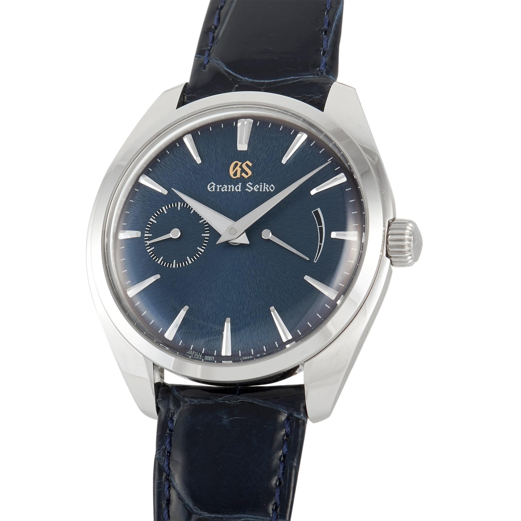 The Grand Seiko Watch, reference number SBGK005, is an upscale piece that exudes a timeless sense of sophistication. 

The beauty of this timepiece begins with the polished stainless steel 39mm case. It houses a captivating blue Mt. Iwate patterned