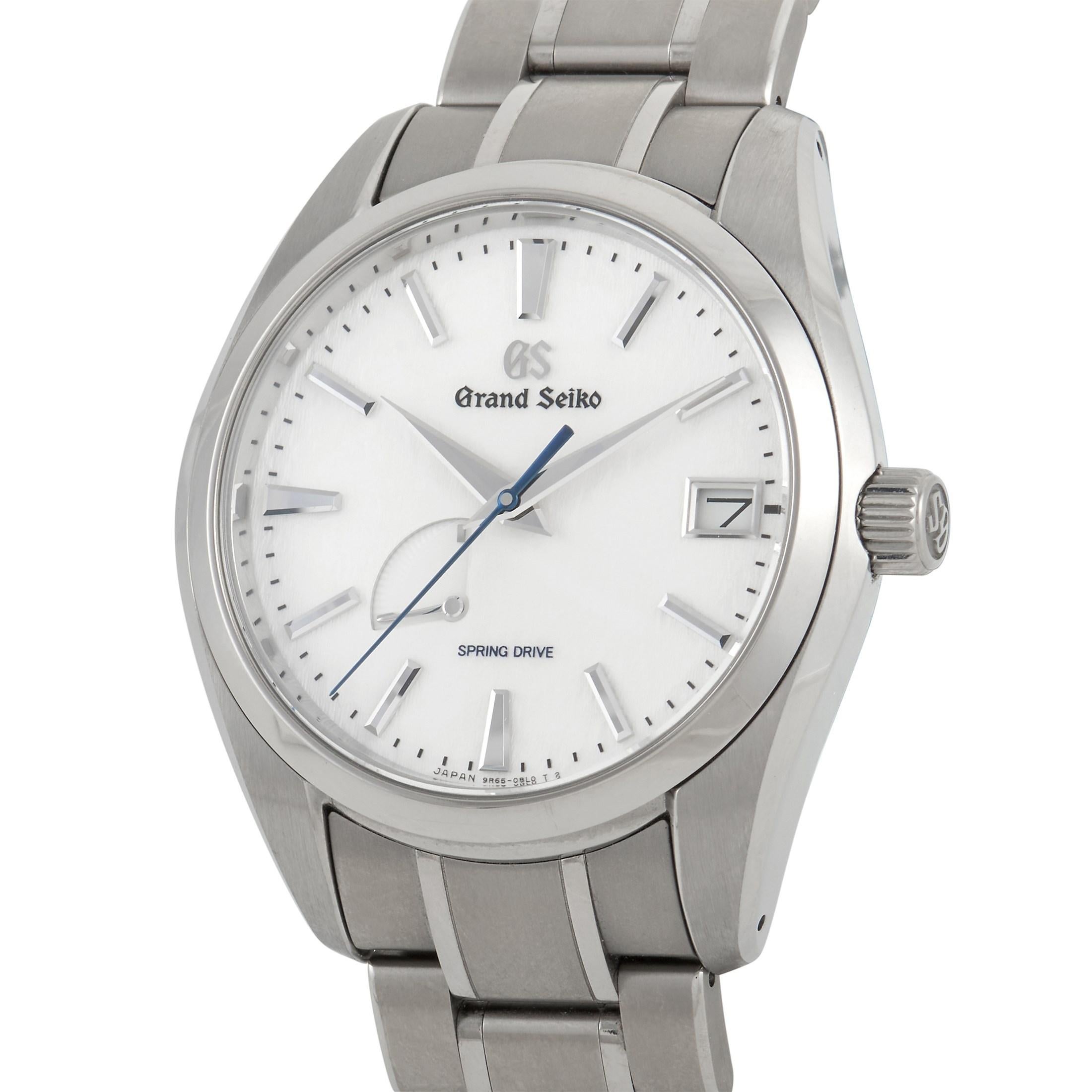 The Grand Seiko Snowflake Spring Drive Watch, reference number SBGA211, is a timeless piece with universal appeal. 

The beauty of this traditional timepiece begins with the 41mm titanium case. Attached to a titanium bracelet, the white minimalist