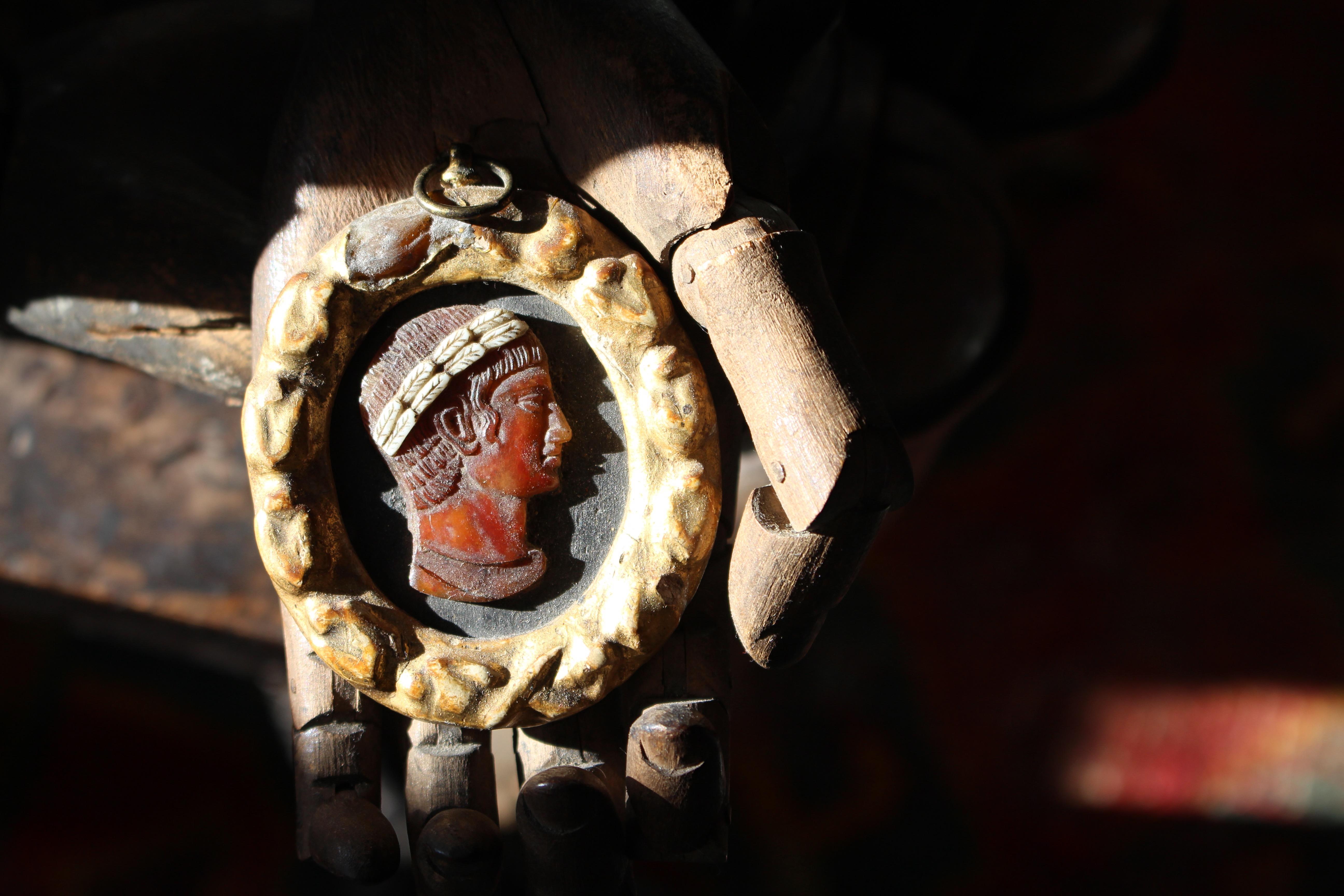 Classical carved shell cameo in its period oil gilt frame

18th century or earlier in age and likely to of been acquired on a grand tour.

A well carved profile portrait with laurel leaf band on a black ground,  inscribed verso - 'Dario Re', 

A