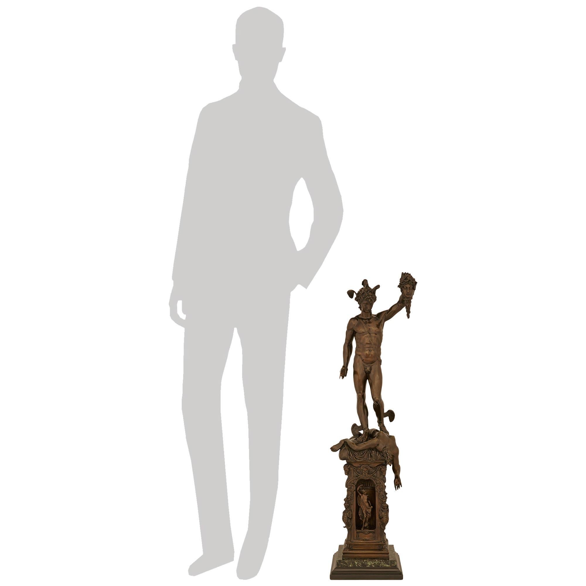 An exceptional Continental 19th century Grand Tour Period patinated Bronze, Black Belgian, and Verde Antico marble statue of Perseus and Medusa. This exquisitely detailed statue of Perseus having vanquished Medusa is based on a model by sculptor
