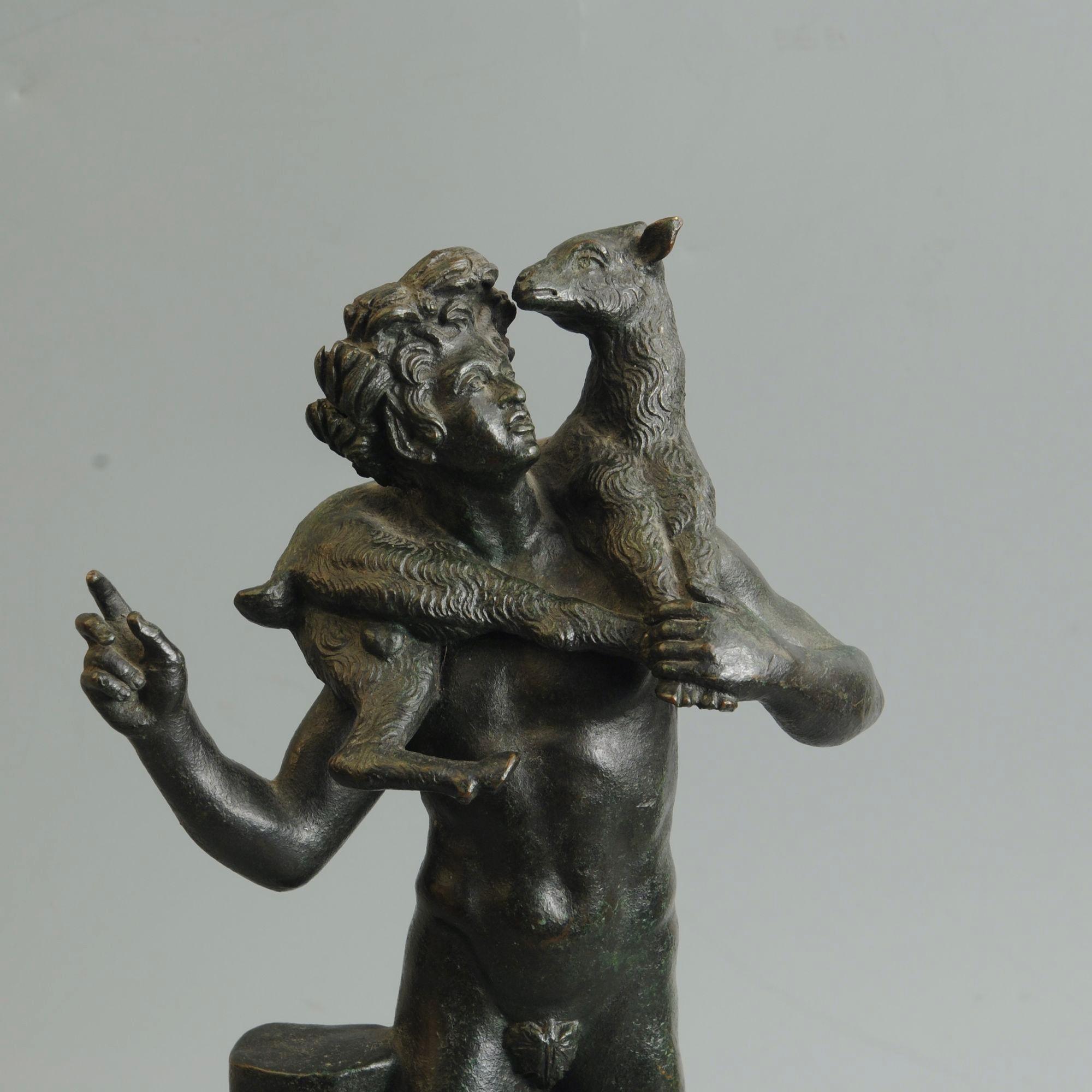 A 19th century Italian grand tour bronze figure of Bacchus with a goat over his shoulders
Circa 1890