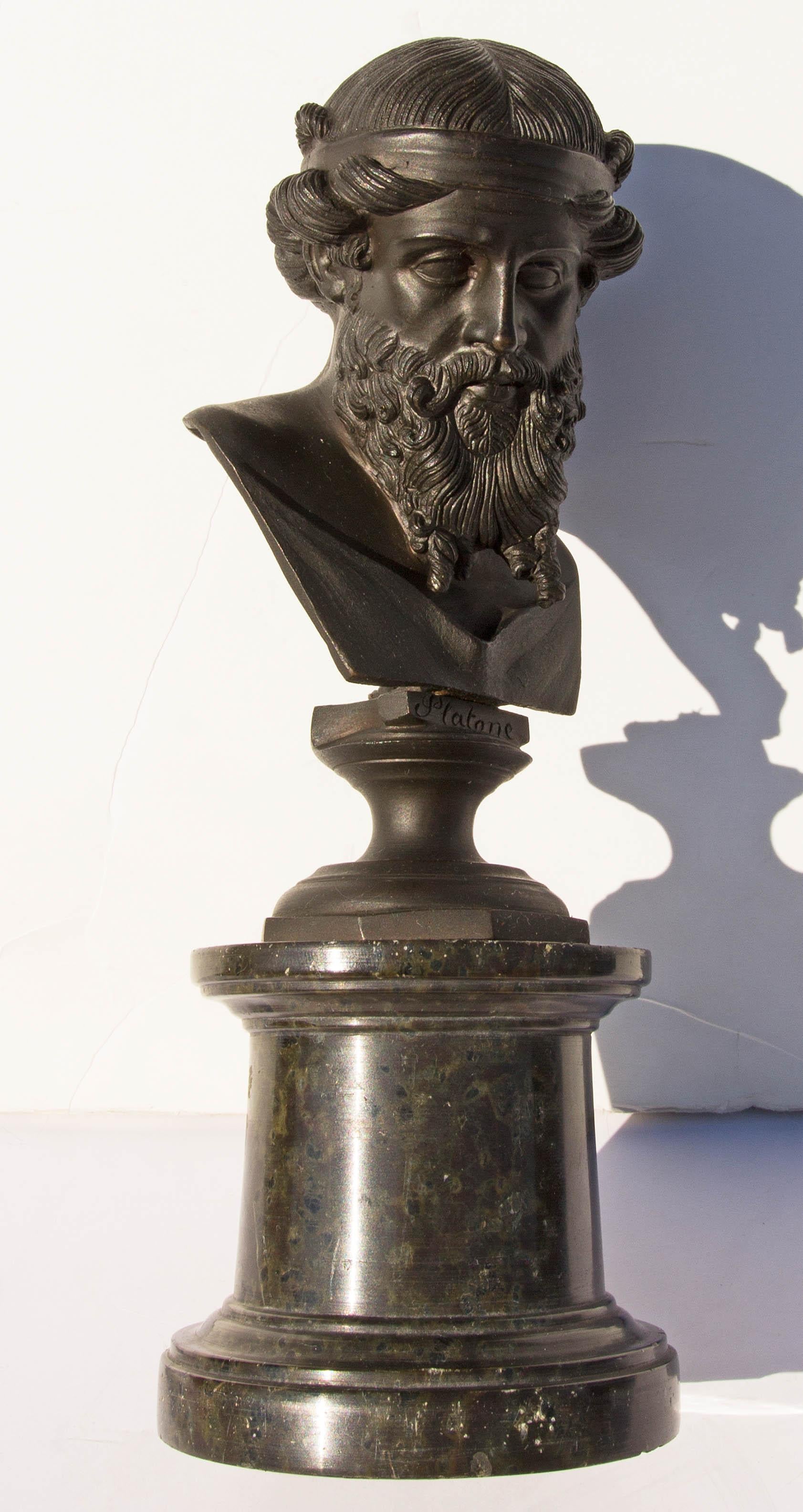 Grand Tour bronze bust of Dionysius. After the original ancient bust found in Herculaneum. Mounted on a marble column. The model is occasionally, alternately identified as Plato or Poseidon.
 