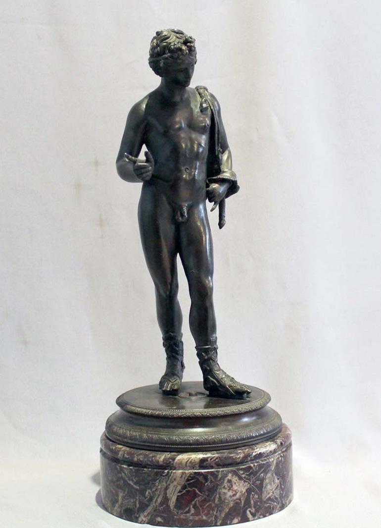 A fine Grand Tour bronze of Narcissus on a circular base of fine griotte marble An excellent cast with high quality finishing and a lovely slightly rubbed patina showing the bleed. One of only a few casts where the eyes have been opened up giving