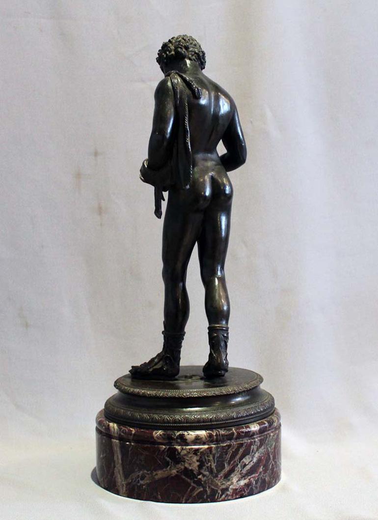 Patinated  Grand Tour bronze of Narcissus on rouge marble base signed Masulli