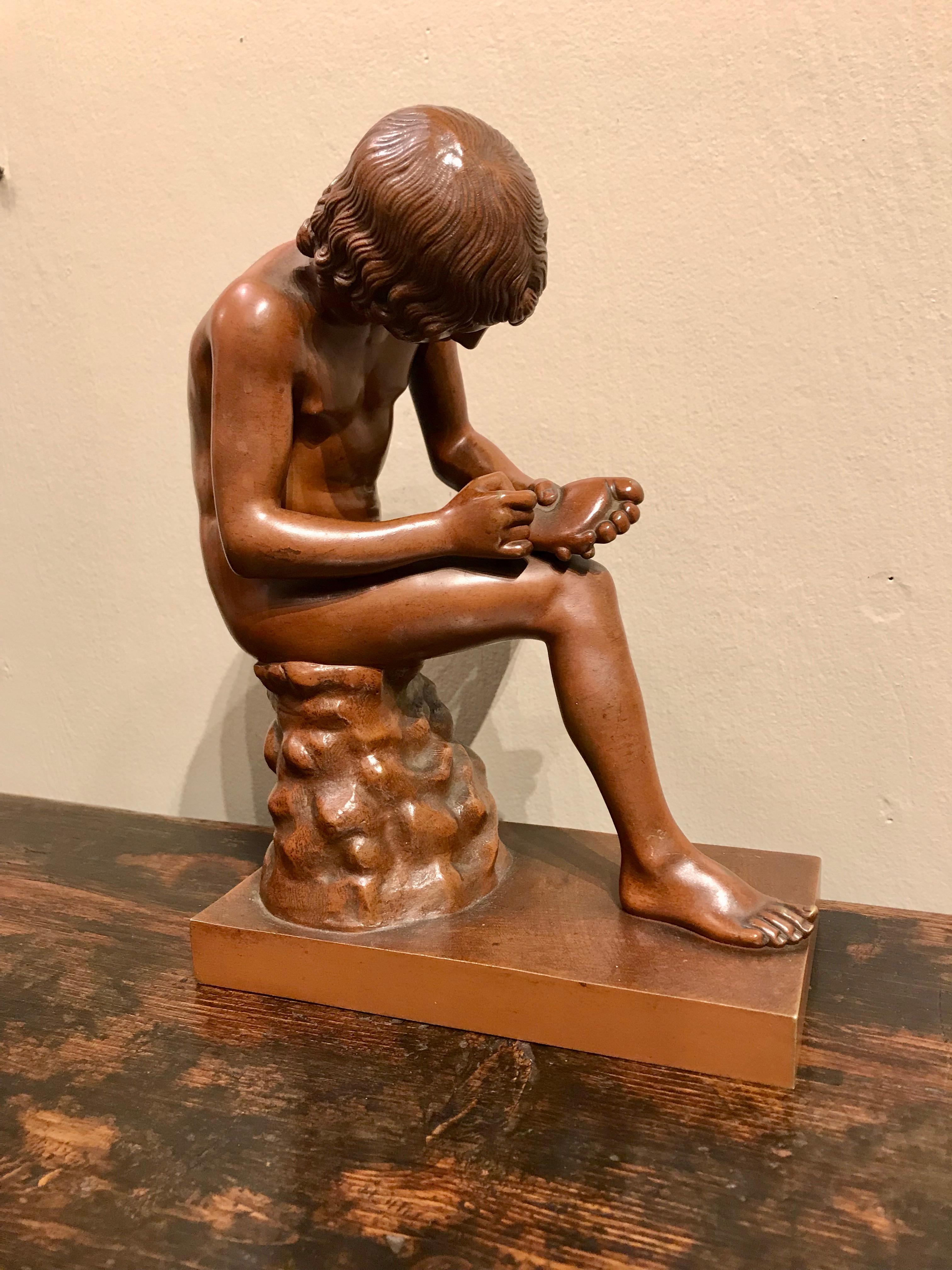 A wonderful 'Grand Tour' cast of 'Spinaro', also known as 'The Boy with Thorn' with a foundry mark of R. Bellair & Co., Berlin. This foundry was known for its rich and luminous copper toned patina that gives the sculpture a life-like quality. After