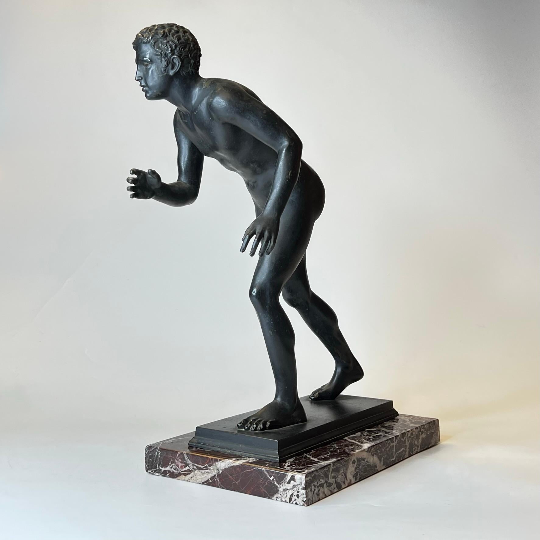 Grand Tour bronze on marble pedestal depicting the bronze runner from the Villa of the Papyri (Herculaneum), in Ercolano, Italy.  Cast by Sabatino deAngelis of Naples in 1906.  In good condition.  Bronze measures 17.5 by 13 by 6.5 inches.  Separate