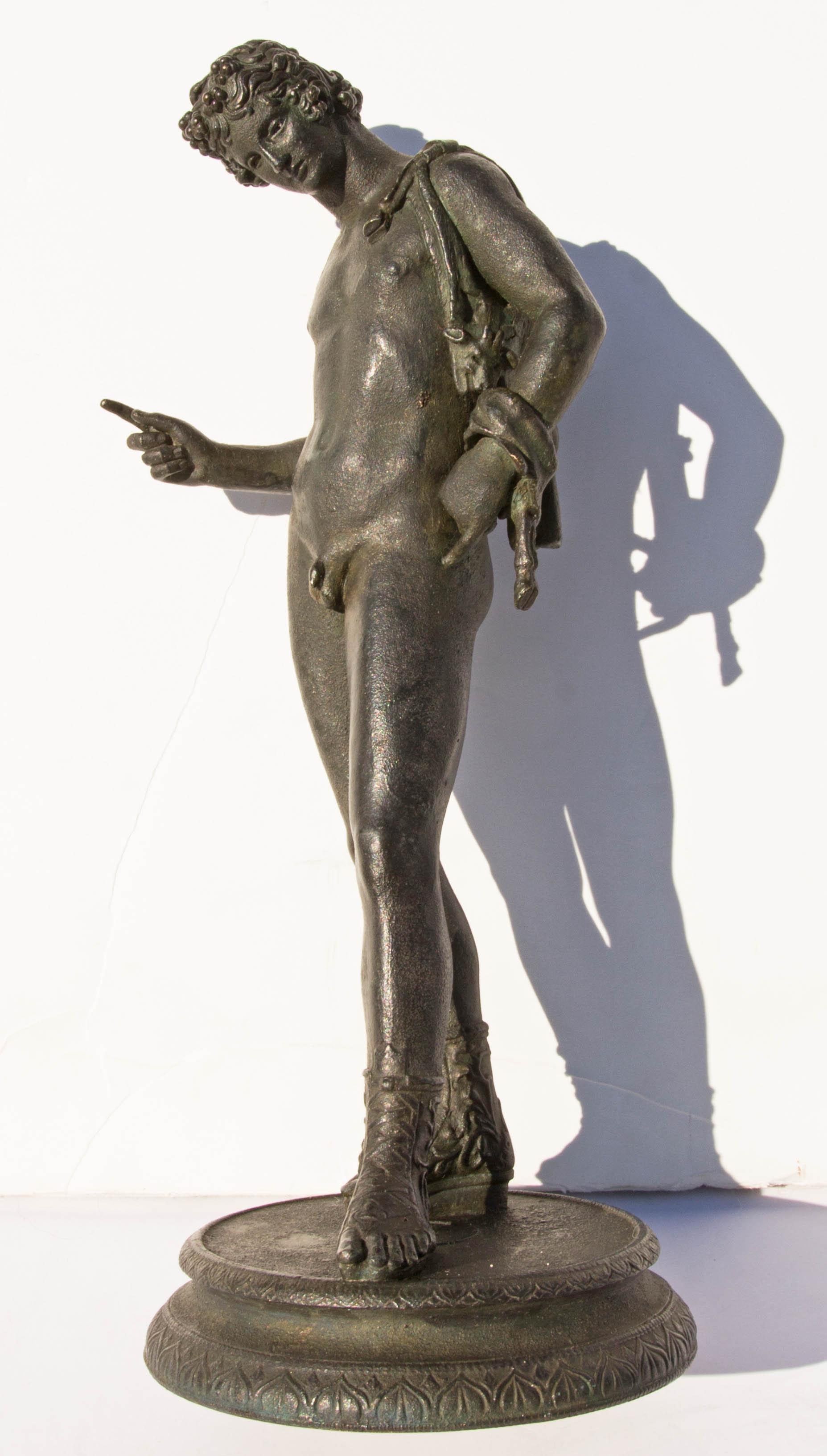 Grand tour bronze sculpture of Narcissus after the original found in 1862 at Pompeii. When first found in Pompeii it was identified as Narcissus. Years later it was identified as Dionysus, 19th century.