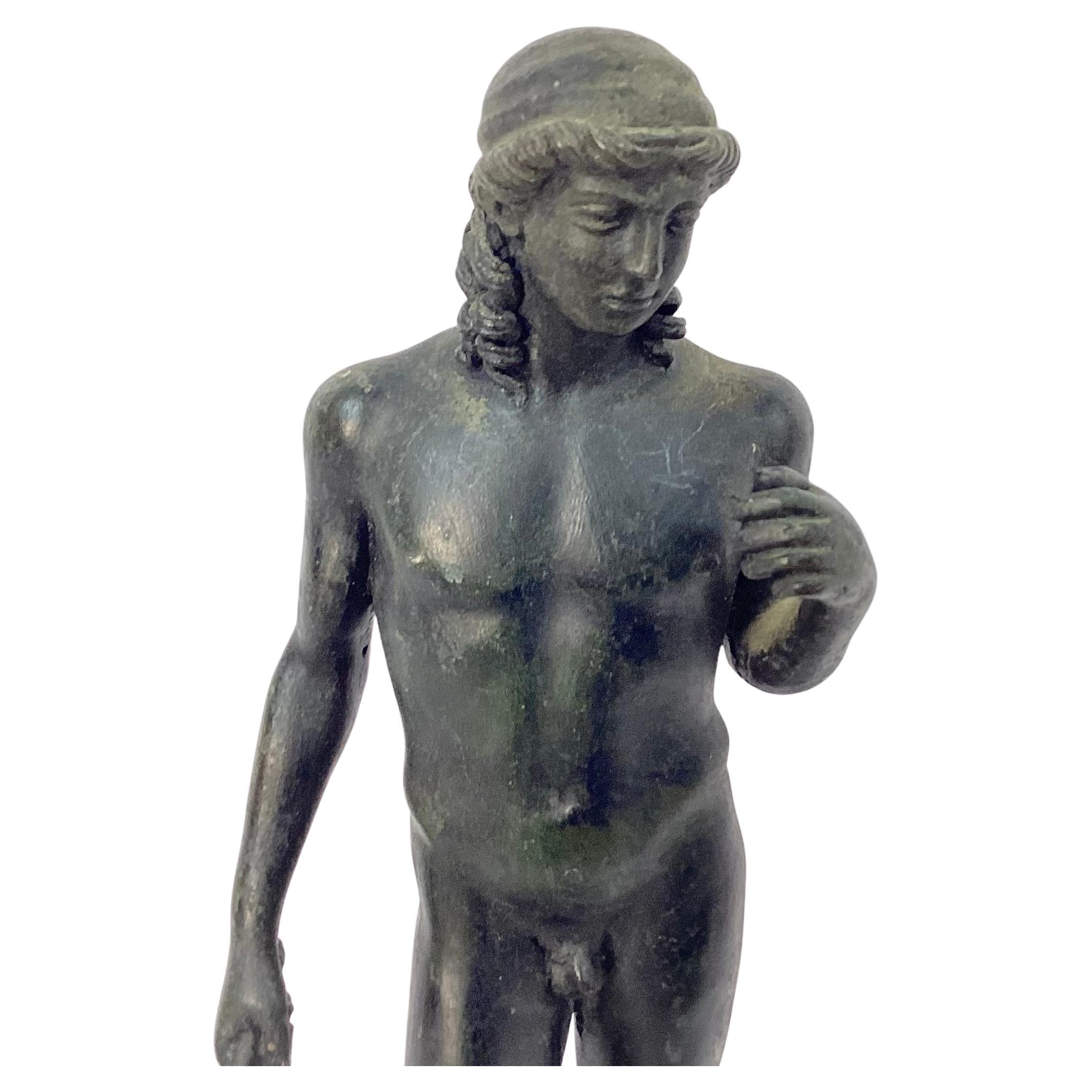 19th century Grand Tour bronze statue of the ancient Greek Dionysus. Dionysus also known as Bacchus, was the god of wine, fertility and festivity. Nice aged patina. Statue stands on a round bronze base.  