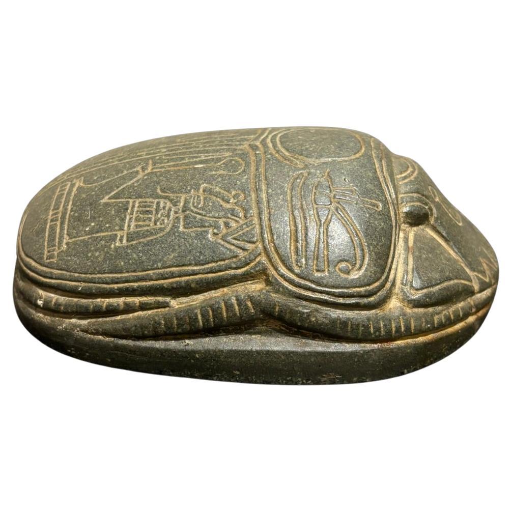 What does the Egyptian scarab symbolize?