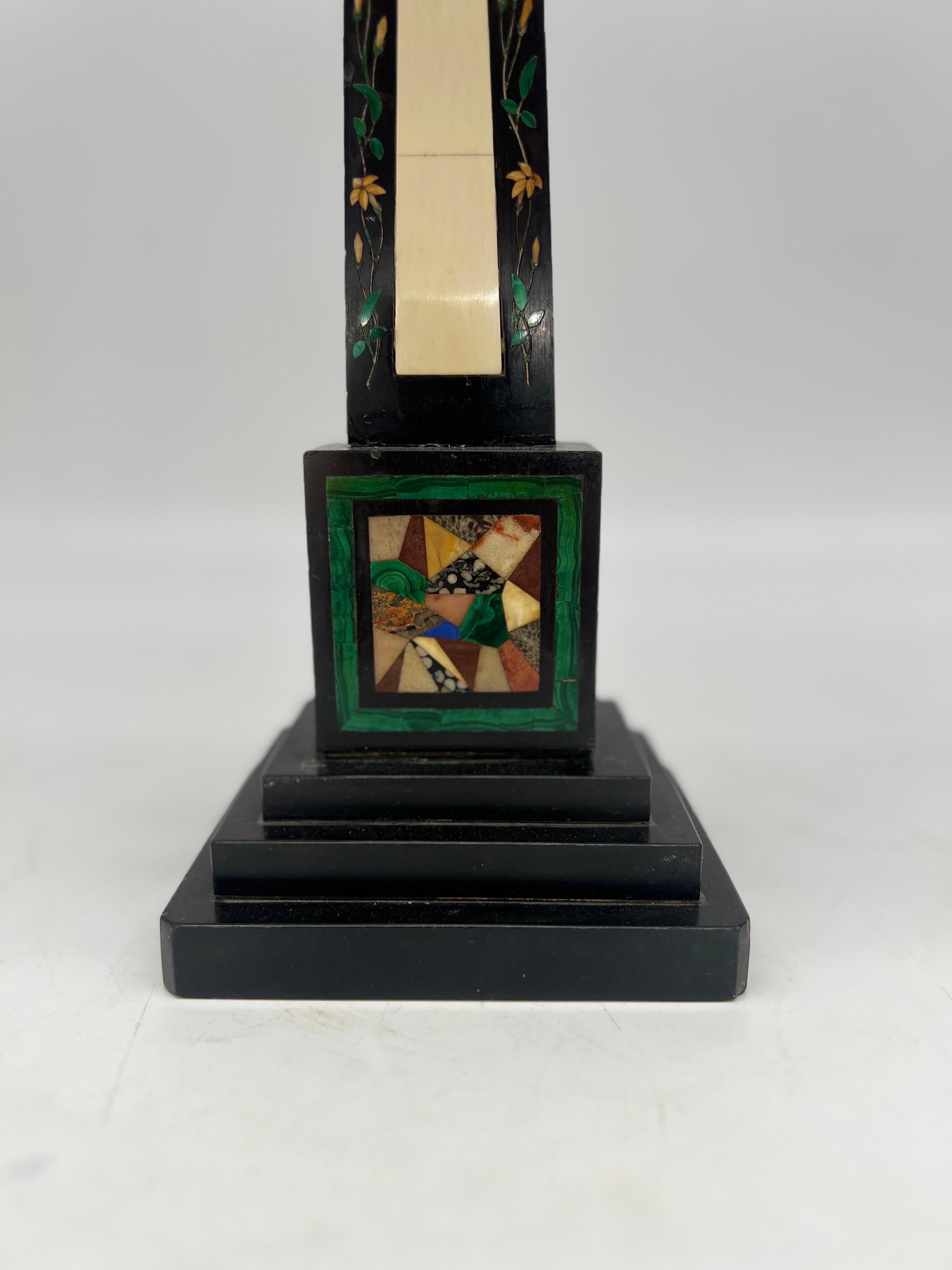Continental, 19th century.

A grand tour era (possibly Italian) obelisk constructed with a stepped black marble square base, a highly decorated mixed material stem which consists of malachite, lapis, granite, marble and other semi-precious stones.