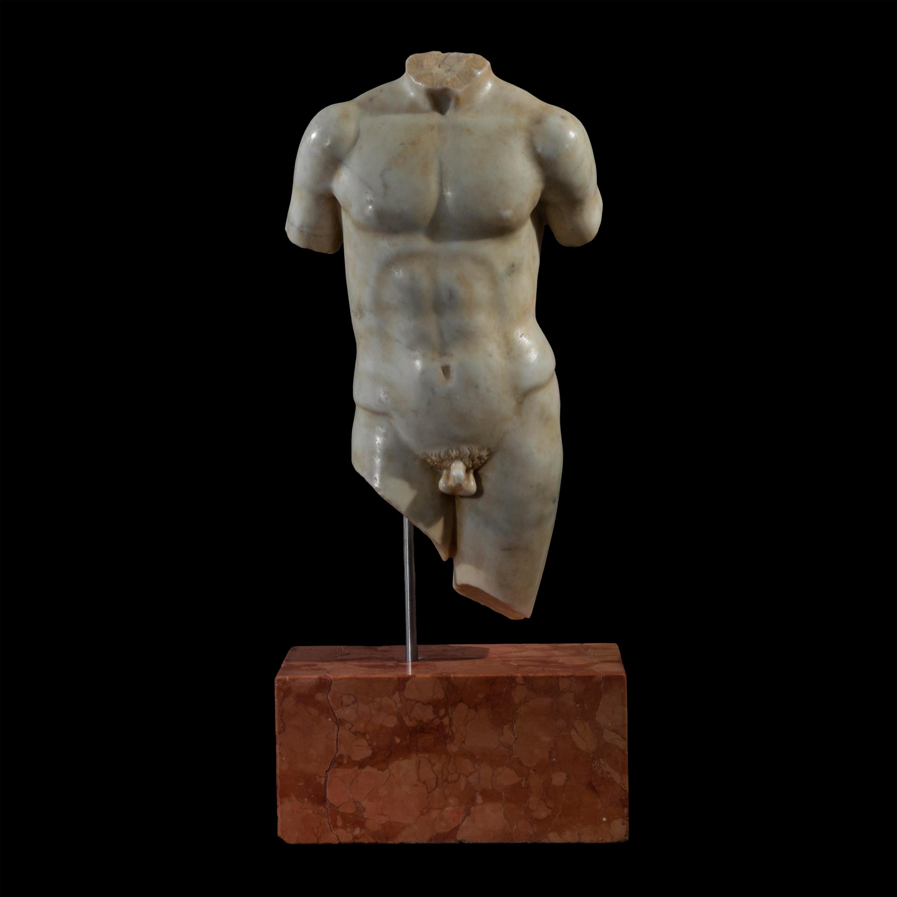 A delightfully detailed nude figure of a youthful athlete, finely sculpted Carrara marble in the ancient Greek or Roman style, mounted on a Rosso Verona base.
Italy, circa 1900.

Why we like it
The ultimate Grand Tour souvenir, this delightful