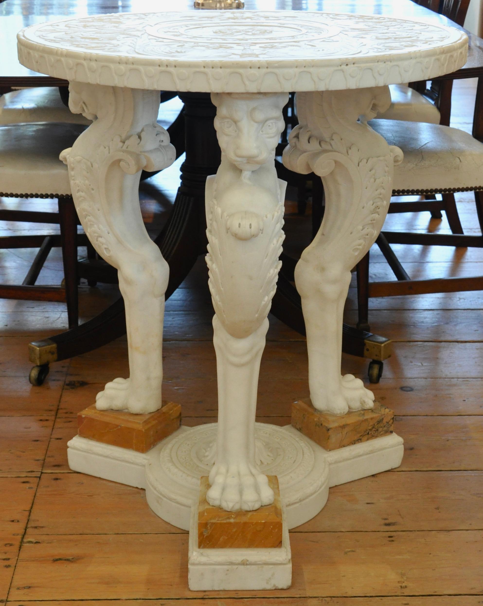 Mid 19th century carved marble gueridon in the neoclassical taste. All marble. Carved throughout. Top carved in full classical style. Monopod lion legs , tripartate base. Wonderful tracery carvings (see details). Statuario and siena marbles. Of the