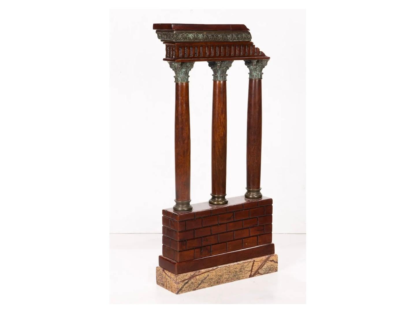A Grand Tour bronze mounted mahogany and marble model of Roman Ruins, 20th century. This is a rare and exceptionally made model of the Grand Tour period as it is made from carved mahogany and bronze capitals resting upon a marble base. Very nice