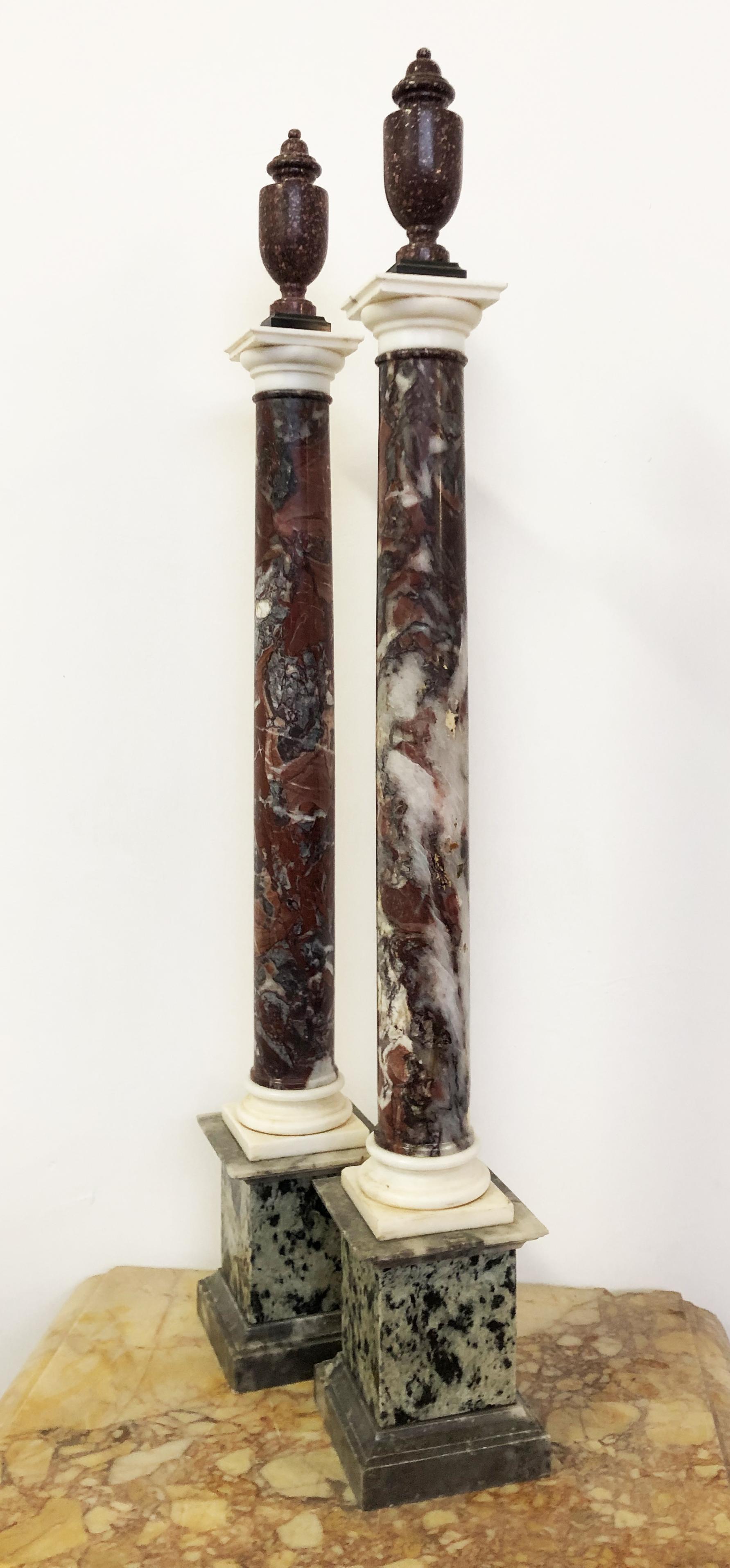 A very beautiful and impressive pair of grand tour column with a pair of neoclassical porphyry vase on the Tuscany style capital. The opera, is a collection of specimen ancient marble and a very impressive exercise of style. The selection of very