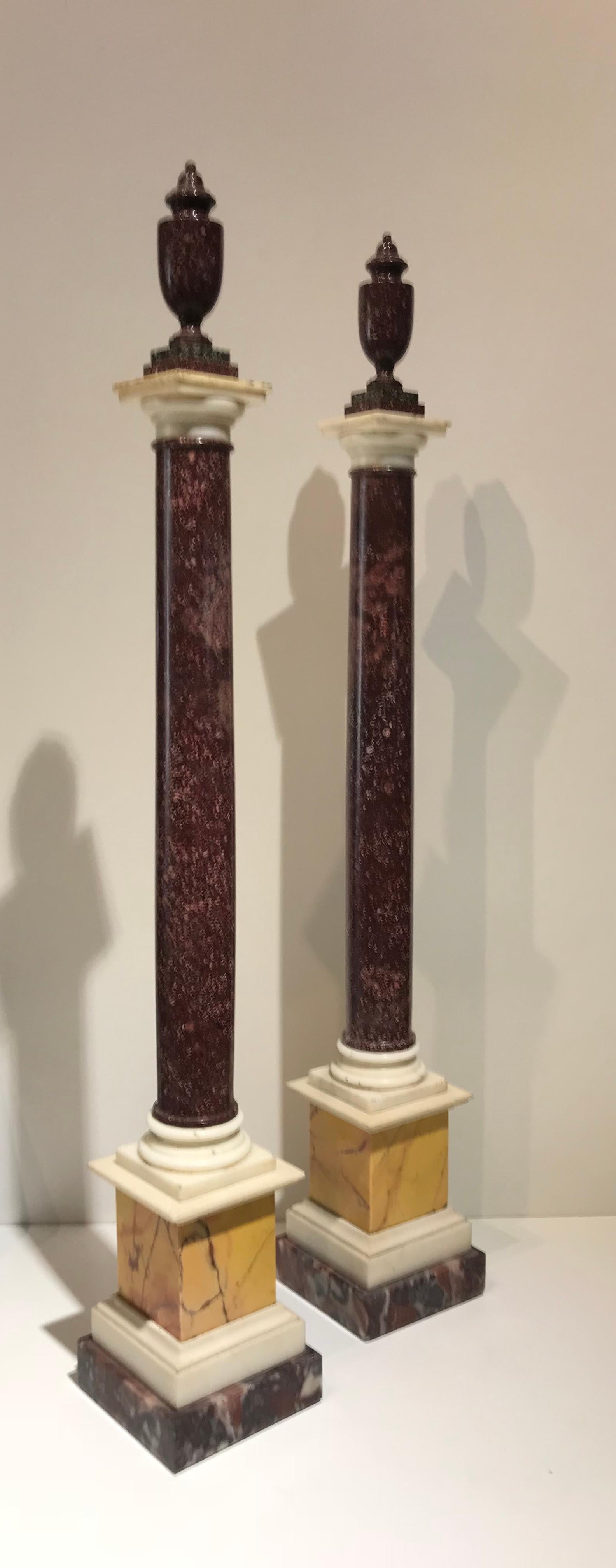 A very beautiful and impressive pair of grand tour column with a pair of neoclassical porphyry vase on the Tuscany style capital. The opera, is made with a selection of specimen and very rare marble, Africano marble, statuary marble and yellow