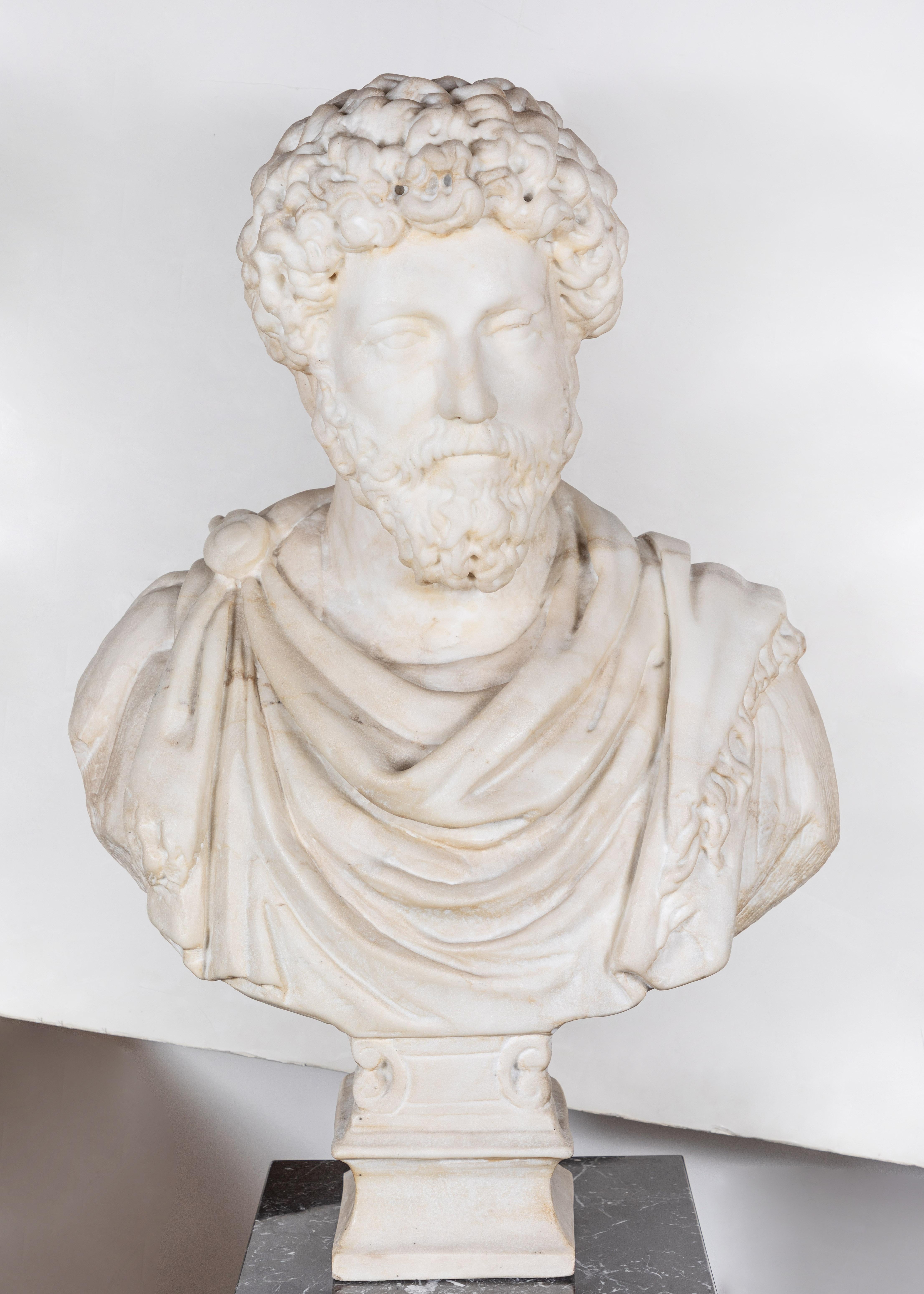 Larger than life, beautifully carved, Carrara marble bust of a noble figure in clasped robes- perhaps the Emperor Hadrian (24 January 76 CE–10 July 138 CE), known as one of the 