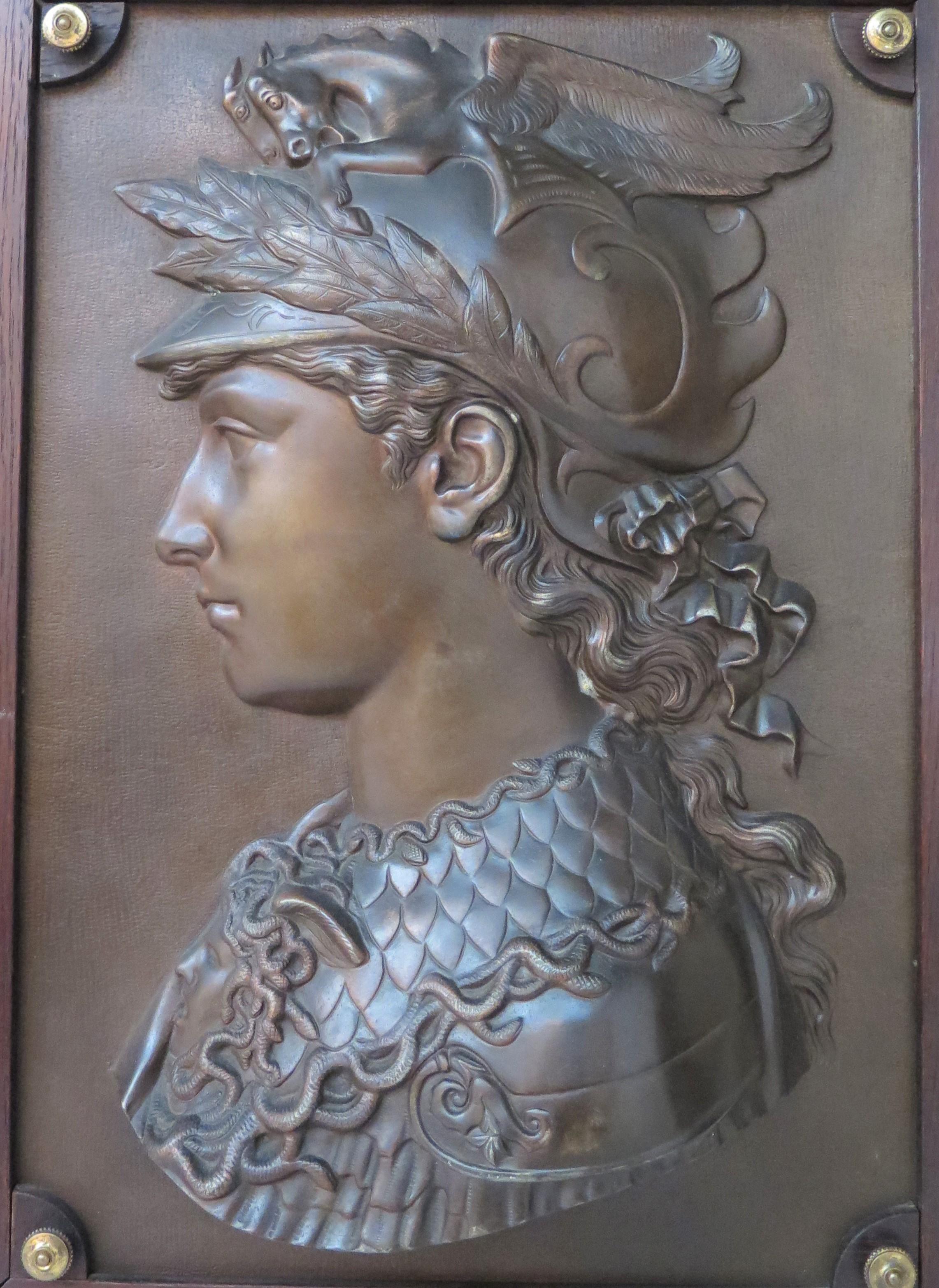 a pair of Grand Tour souvenir bronze bas relief portrait plaques mounted in wooden frames with ring hangers (left) bust of Perseus, (right) bust of Alexander the Great, French, late 19th / early 20th century

24.25'' H x 18.5'' W x 4.5'' D 
