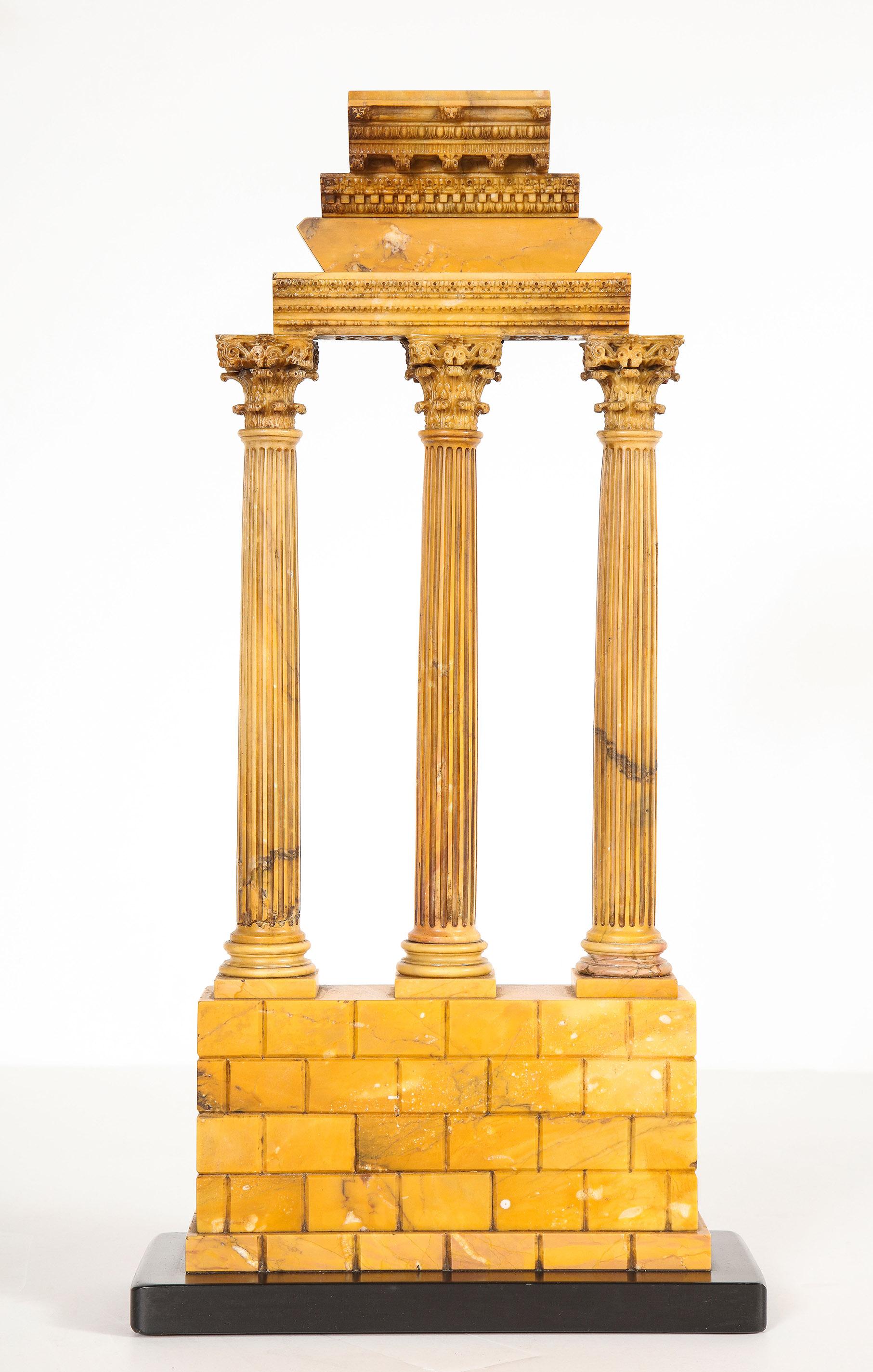 Carved Giallo Antico Grand Tour model of the temple of Caster and Pollux

Large carved Giallo Antico Grand Tour model of the temple of Caster and Pollux of superb carving, the fragmented cornice above fluted Corinthian columns and temple