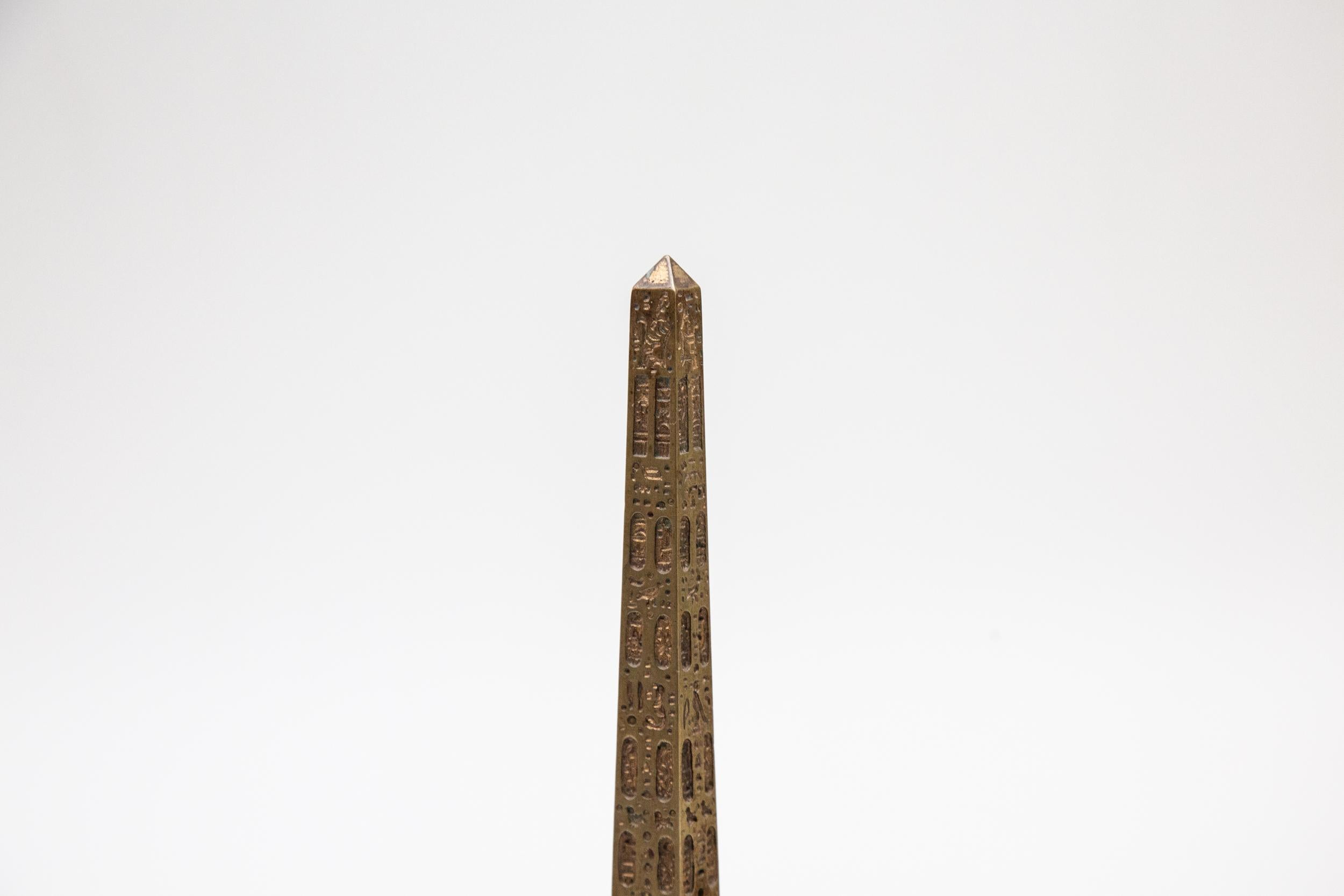 Grand Tour Souvenir Model of Luxor Obelisk mounted on a dark red marble base. The Luxor Obelisks are two ancient Egyptian obelisks carved to stand either side of the portal of the Luxor Temple in the reign of Ramesses II. The left obelisk remains in