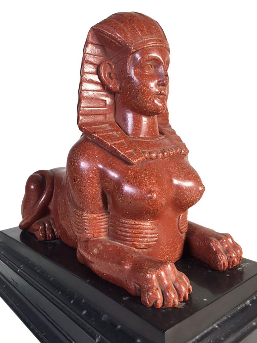 A late 18th century grand tour era Egyptian marble sphinx. Sphinx is sitting on attached black marble base.