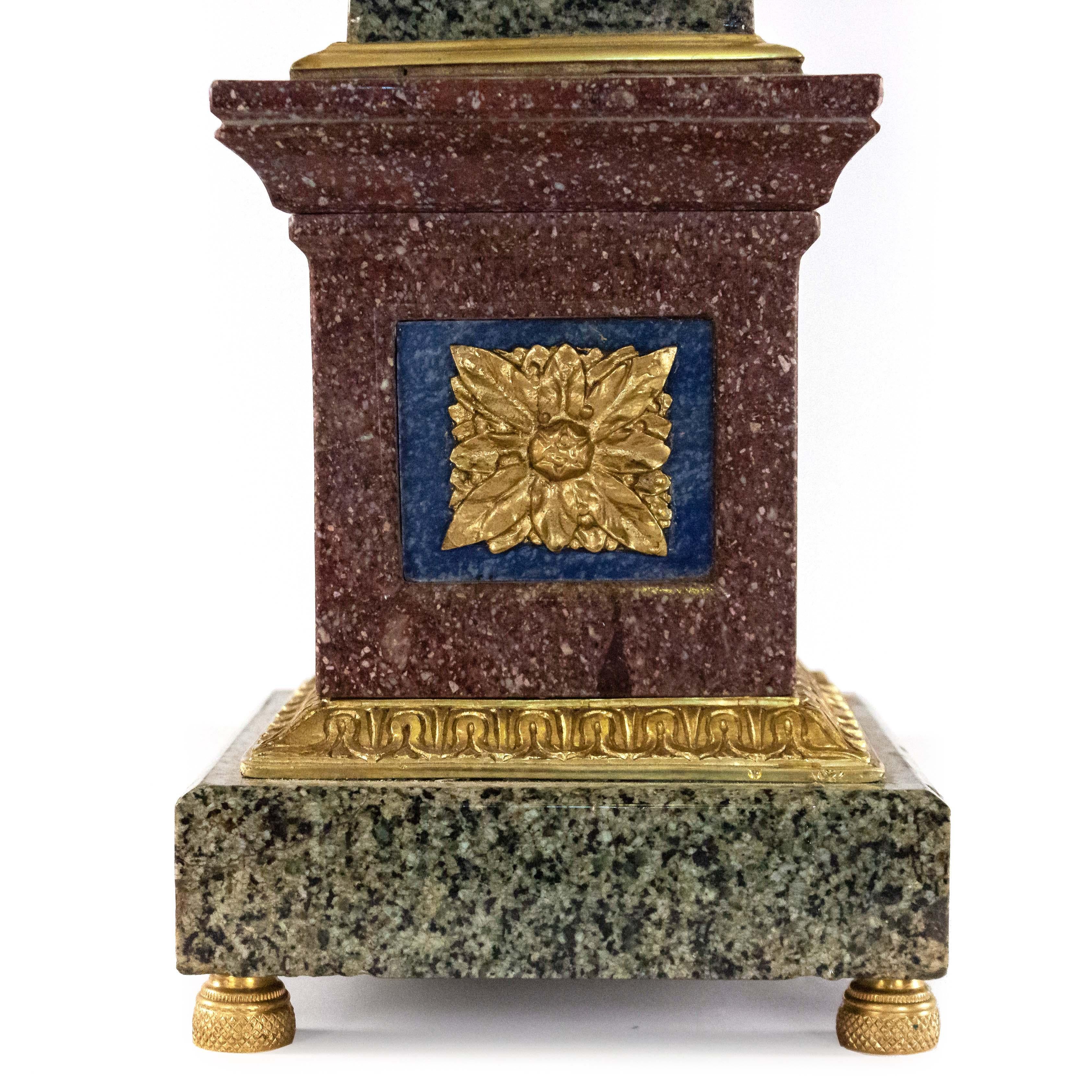 Pair of Italian neoclassic Grand Tour style (19th-20th Century) bronze mounted hard stone obelisks with porphyry bases.