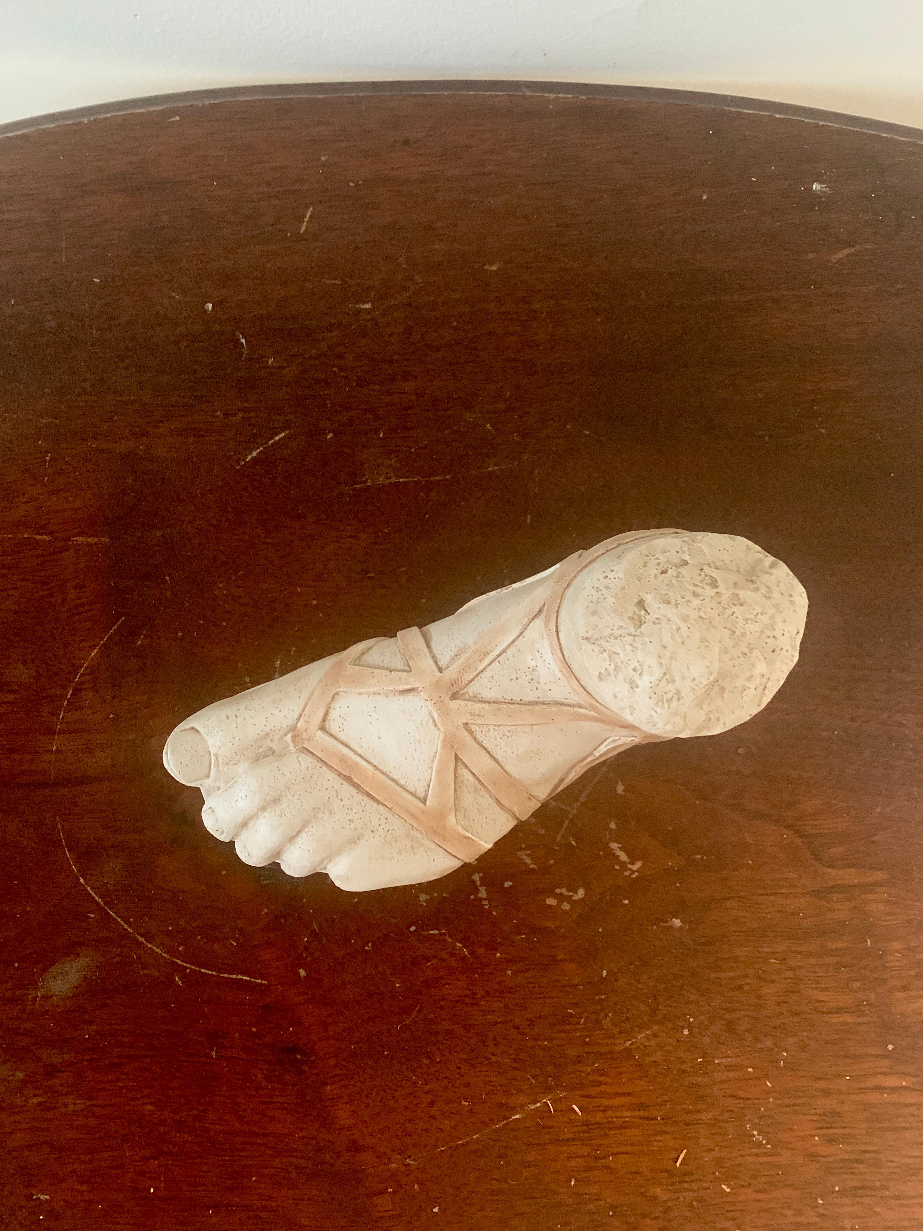 A gorgeous Grand Tour style cast plaster sculpture of an Ancient Greek or Roman foot

Greece, Late 20th Century

Measures: 7.88