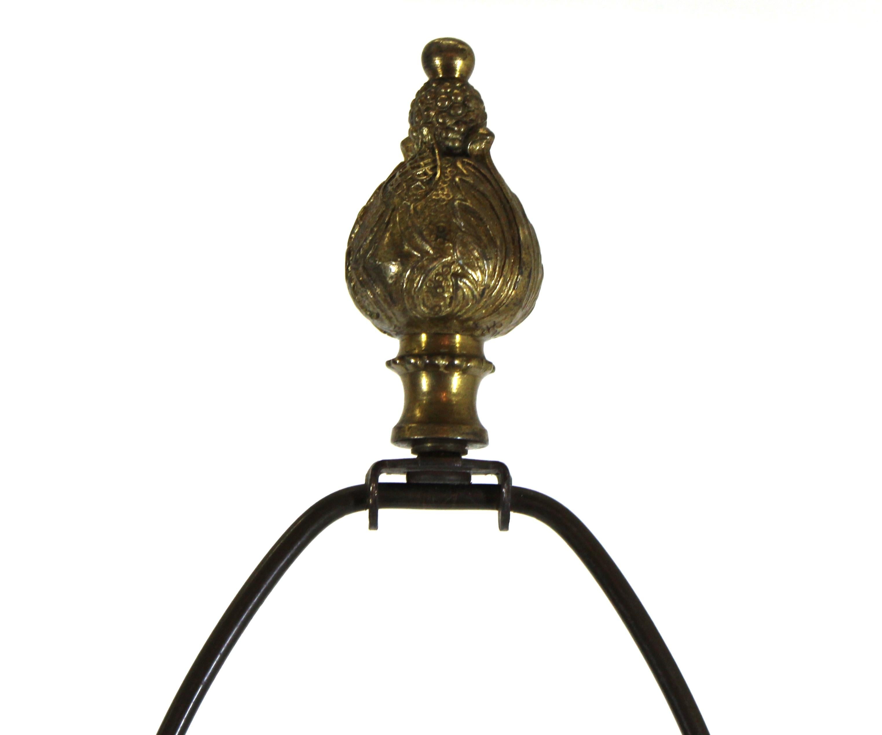 Grand Tour style heavy bronze table lamp, column shaped on pedestal with lyre motif, atop a marble base on ornamental lions feet. 44.5