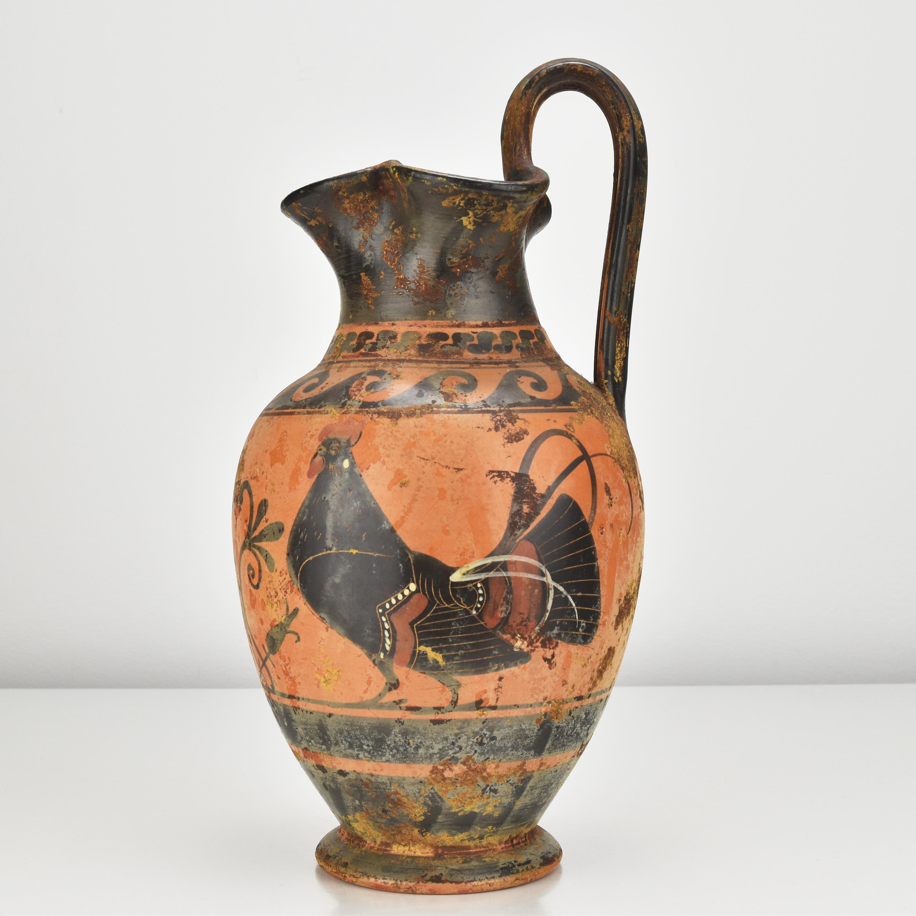An excuisite handcrafted antique Grand Tour souvenir terracotta black-figure Oinochoe wine jug decorated with roosters and a lotus panel, made in Italy in the 19th century.

The roosters, in particular, were highly symbolic in ancient Greek