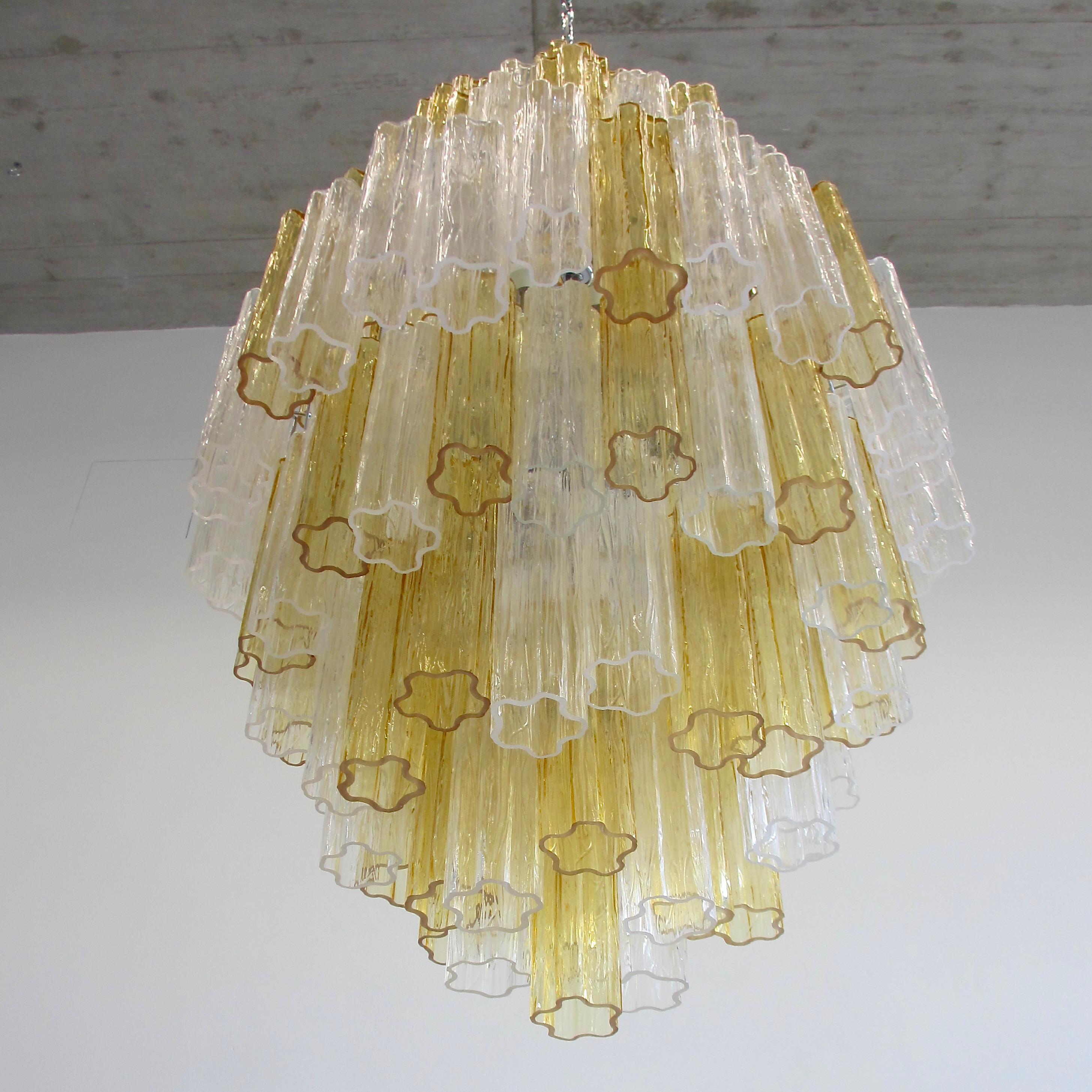 Chandelier with star-shaped 'Tronchi' glass pieces, Murano, Italy.

Large chandelier with chrome metal structure including well over 120 Murano amber and clear glass pieces. Arranged over several layers. Fifteen E27 light fittings, chrome metal