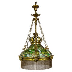 Lampe à suspension mascaron de style Grand Victorien/Art Nouveau en verre delag vert et laiton. I+I