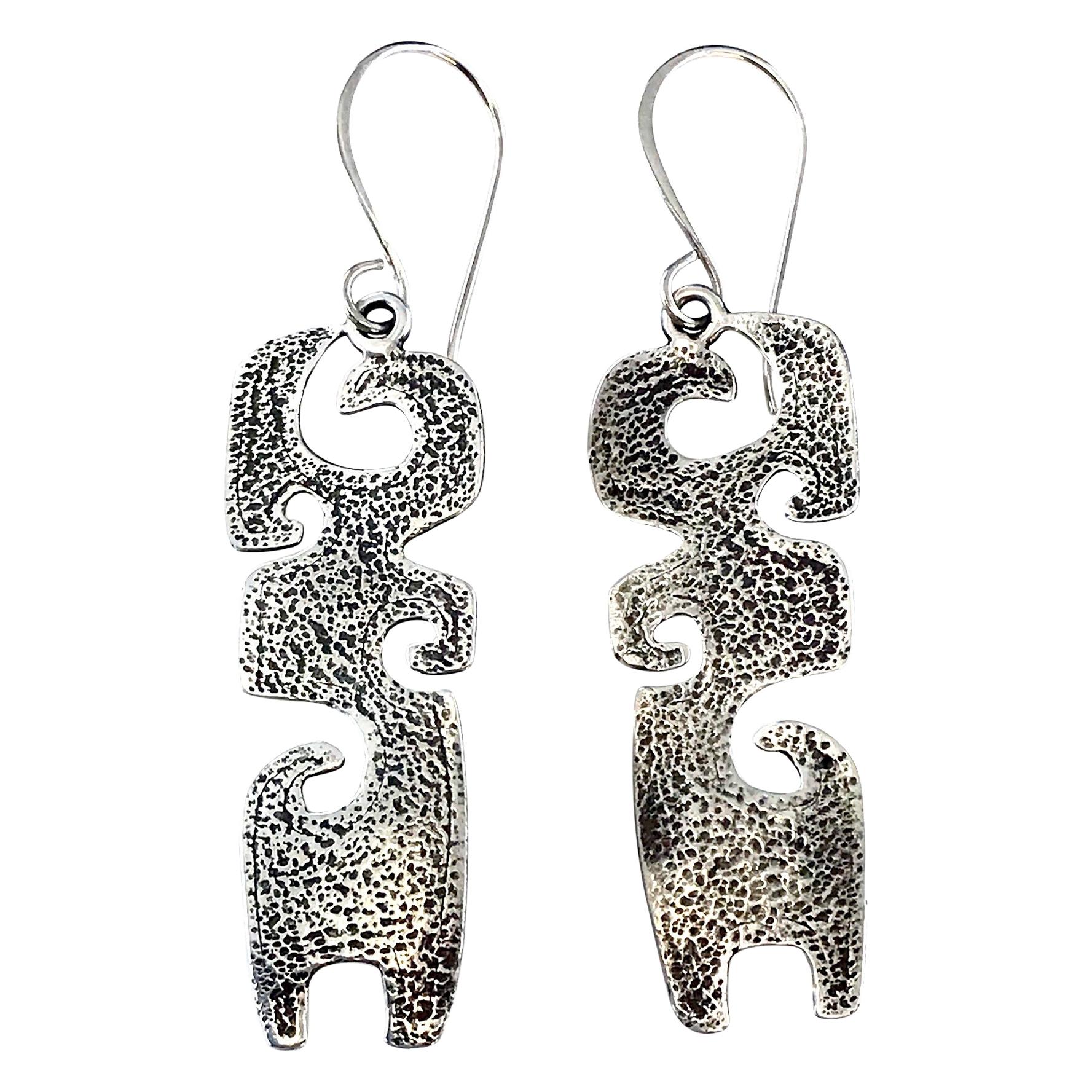 Grandchildren, cast silver earrings Melanie Yazzie contemporary Navajo designs

This is part of a series of imagery Melanie Yazzie uses in her printmaking, sculptures, and jewelry designs. The jewelry designs for Grandmother include this pendant