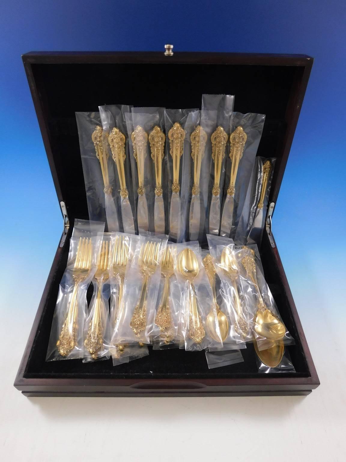 Beautiful Vermeil (completely gold-washed) Grande Baroque by Wallace sterling silver flatware set of 35 pieces. This set includes:

Eight regular knives, 8 7/8