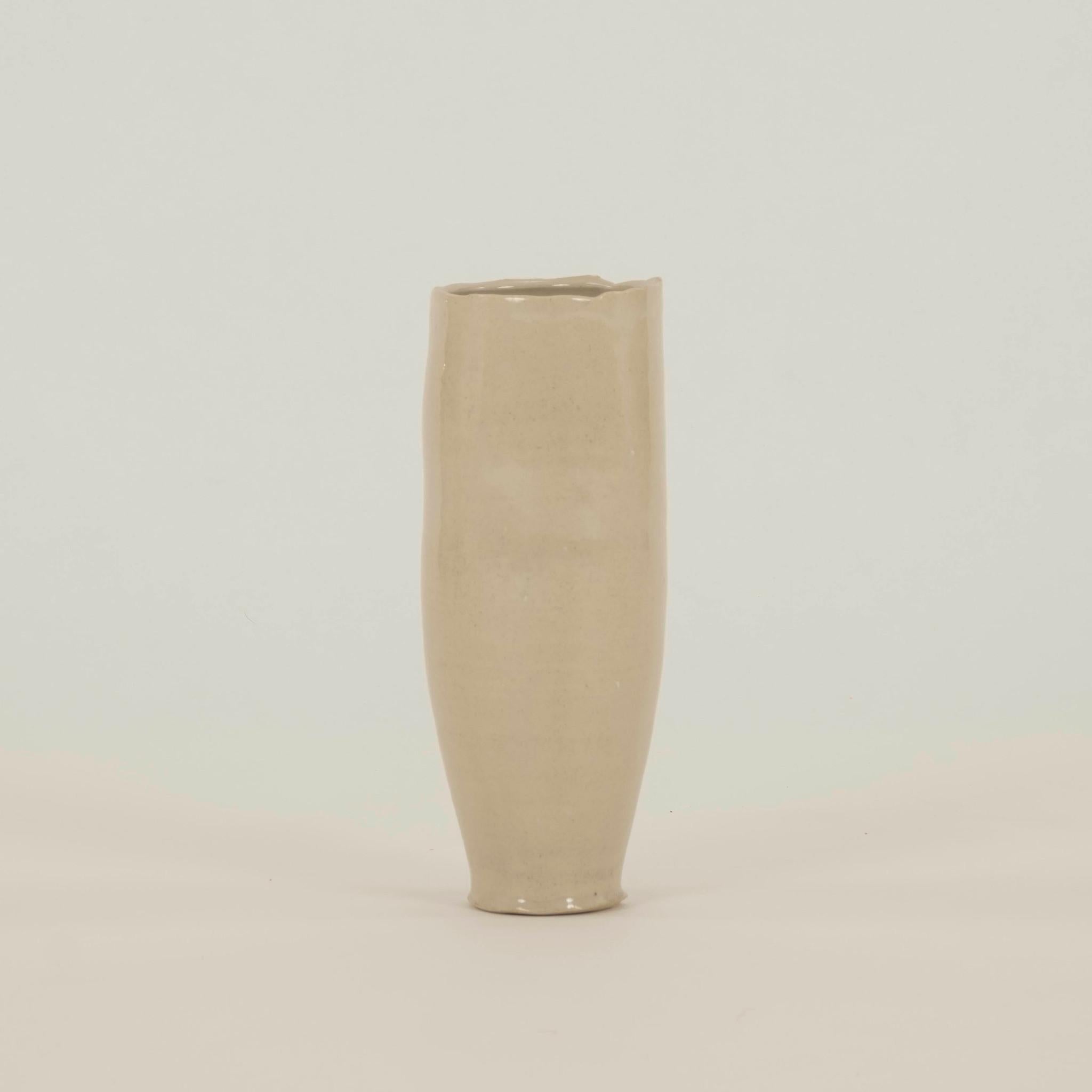 Hand thrown small hole porcelain vase with 24K fire gilt accents.
North America, 21st C
Chase Gamblin

Chase Gamblin is an artist primarily working in ceramics. Currently, he is an Academic Specialist and Studio Coordinator for the Ceramics