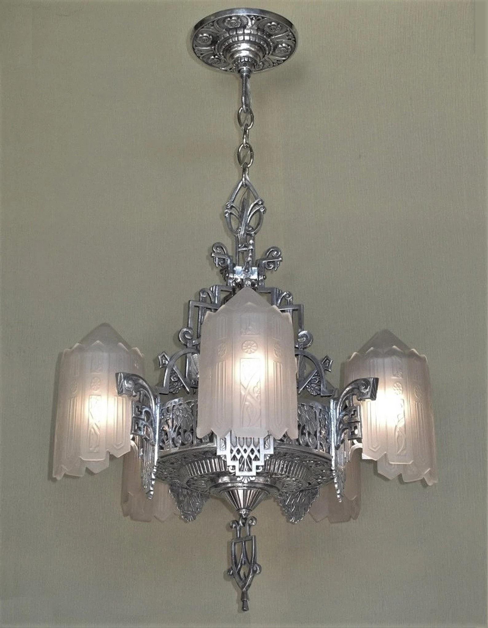 From the heights of the Art Deco movement and the depths of the Great Depression comes Lincoln Lighting Co's, Detroit, Mich., most opulent and beautiful chandelier.
I cannot even begin to describe the intricate, meticulous, detailed and harmonious