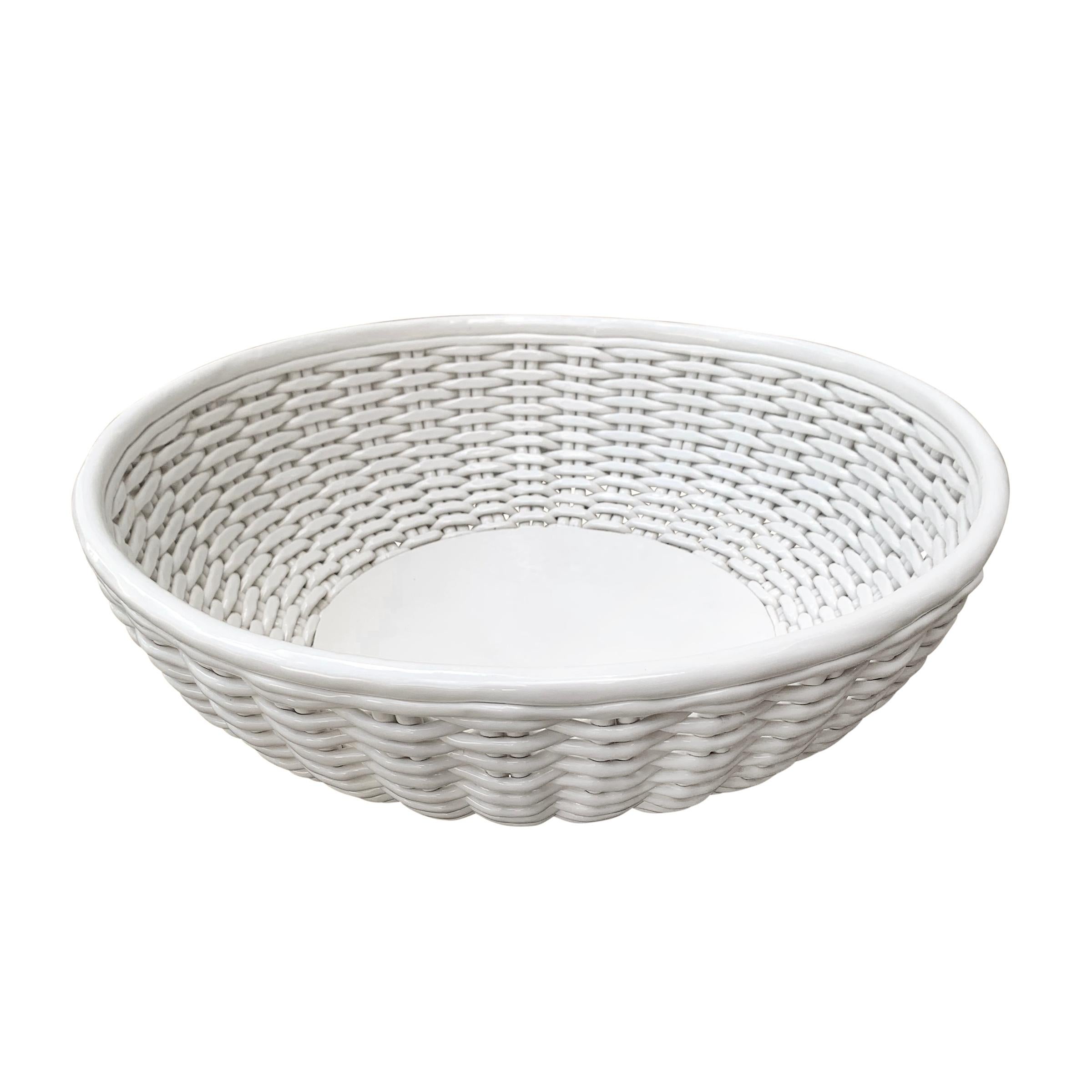 A grande Italian woven porcelain bowl perfect for fruit on your kitchen counter, magazines on your ottoman, mail by your front door, or any other myriad uses around your home.