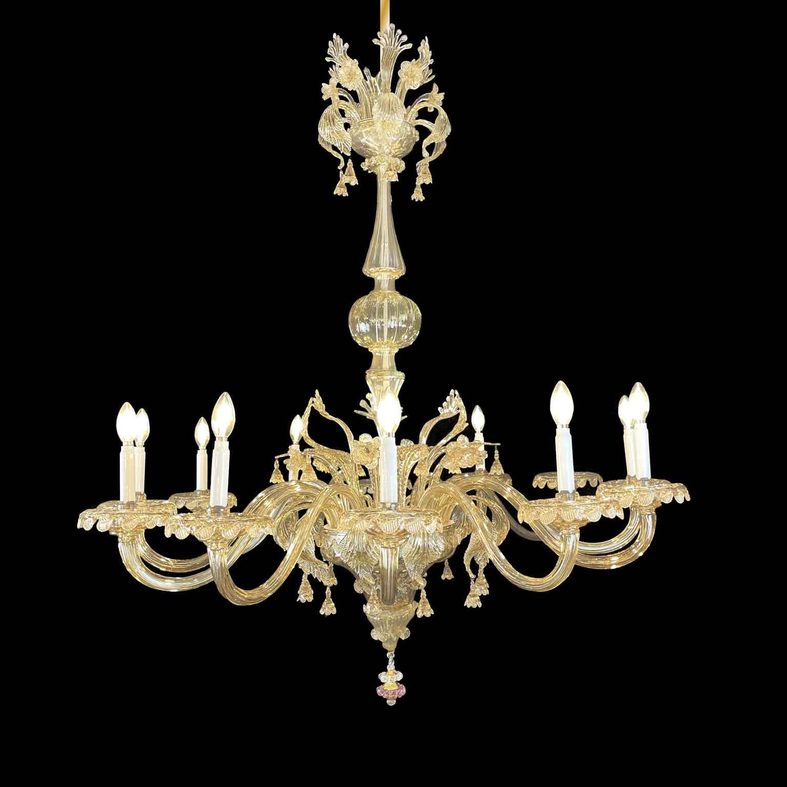 Large 12-Light Early 1900s Blown Glass Chandelier This elegant 12-light blown glass Venetian chandelier, made by the masters of early 20th-century Venetian glassmaking, is a unique and refined piece of art, ideal for prestigious settings such as