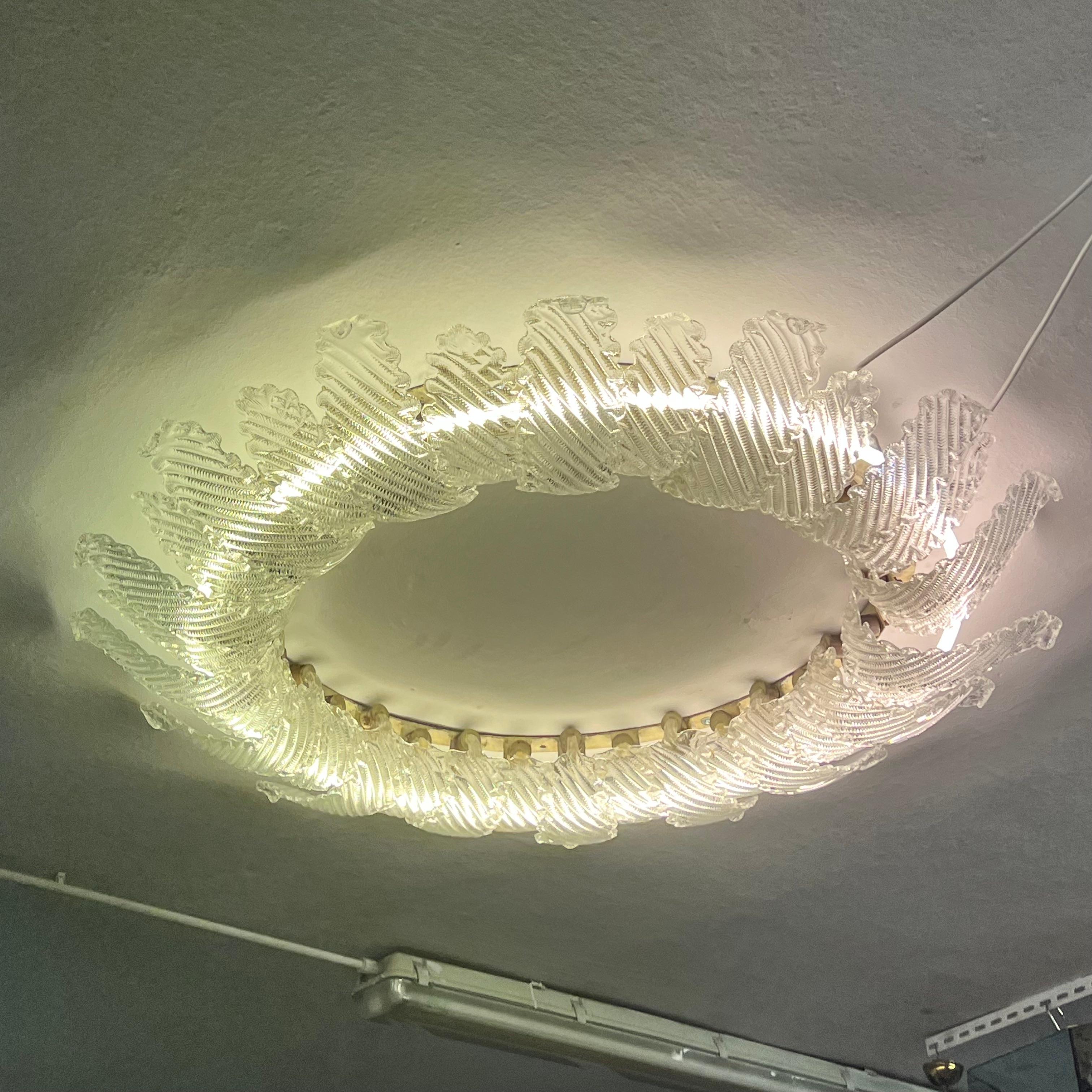 Impressive ceiling light composed of 32 leaves of two sizes, made of handcrafted glass, which alternate and overlap, creating a circle of the impressive size of 122 cm in diameter.
This is almost certainly a commissioned work, so it is UNIQUE