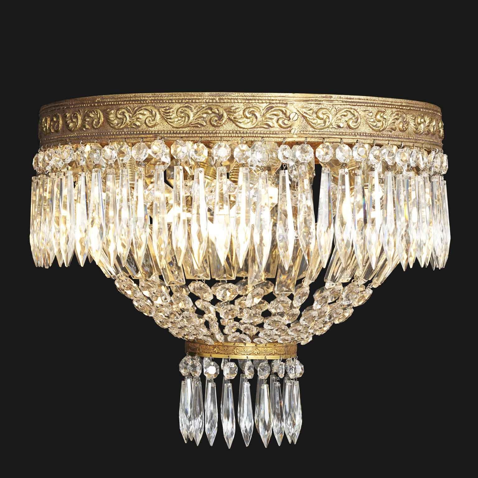 Bronze and Crystal Ceiling Lamp circa 1960, vintage four-light ceiling lamp enclosed within a circular crystal bowl. This suspension of the 1960s  is characterized at the top  by a gilded crown made of cast bronze, decorated with volutes of raised