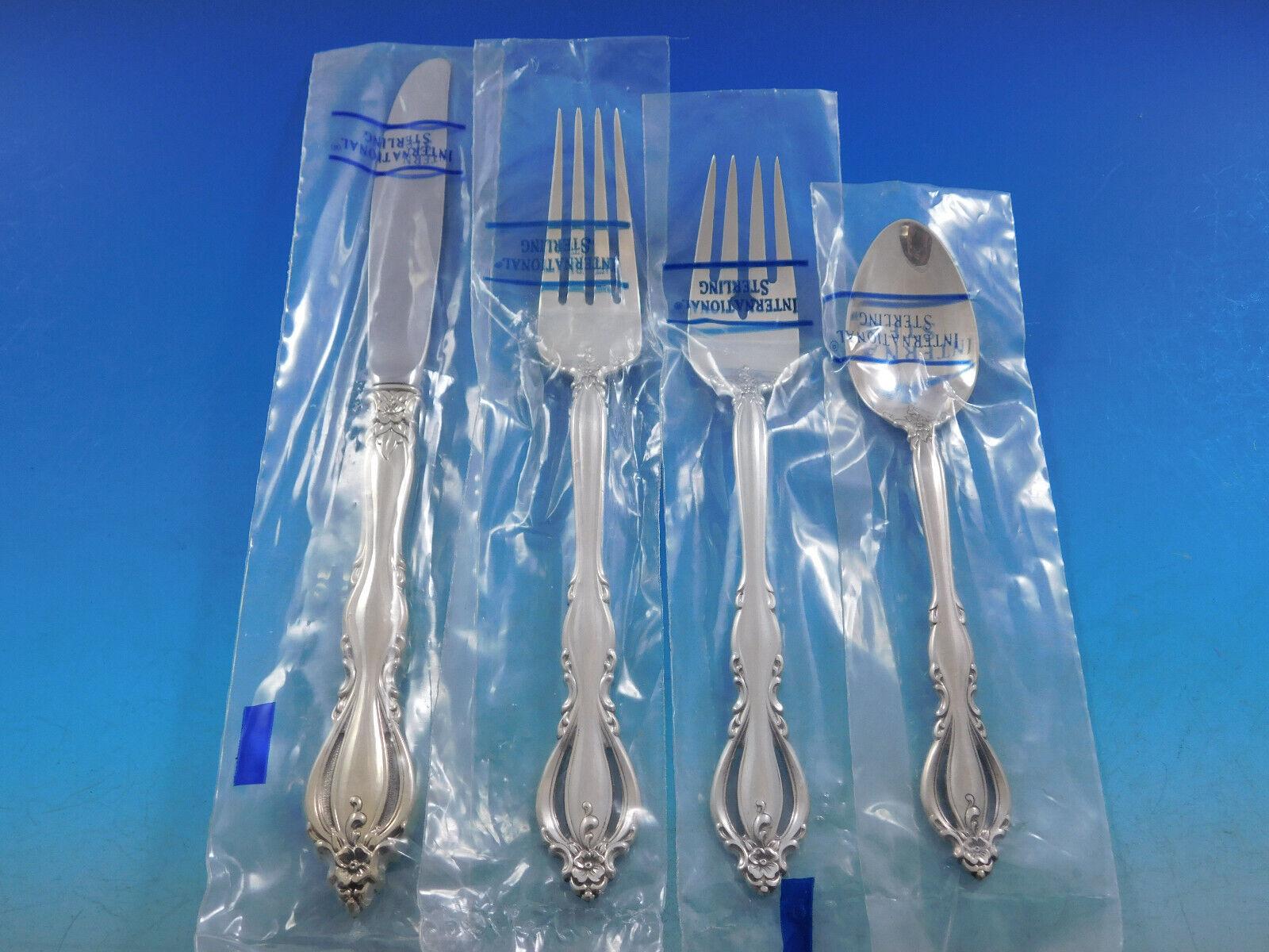 Gorgeous unused Grande Regency by International pierced handle sterling silver Flatware set, 36 pieces. This set includes:

8 Knives, 9