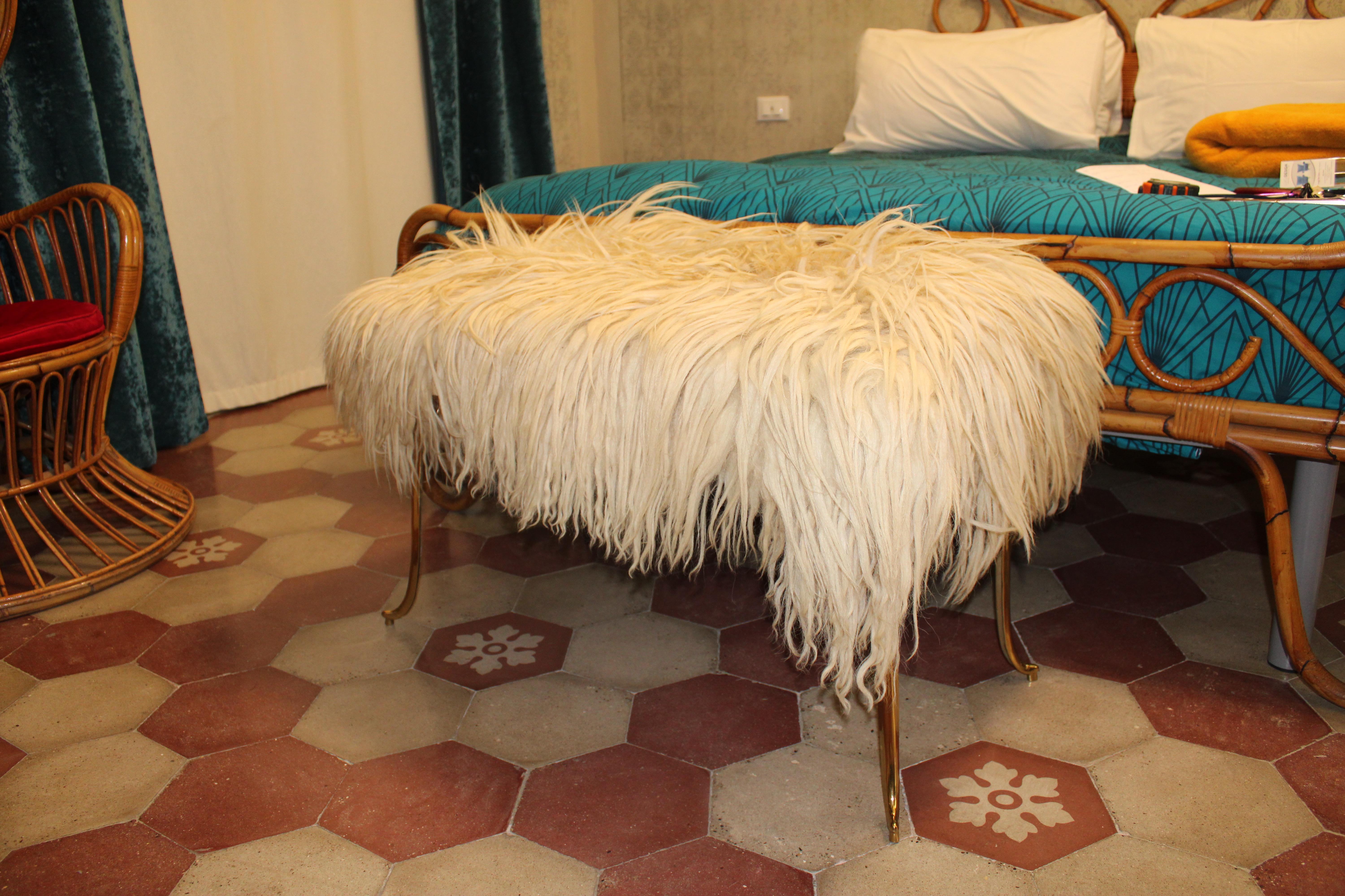 Large rectangular stool with brass feet and natural long Sheep Wool seat .