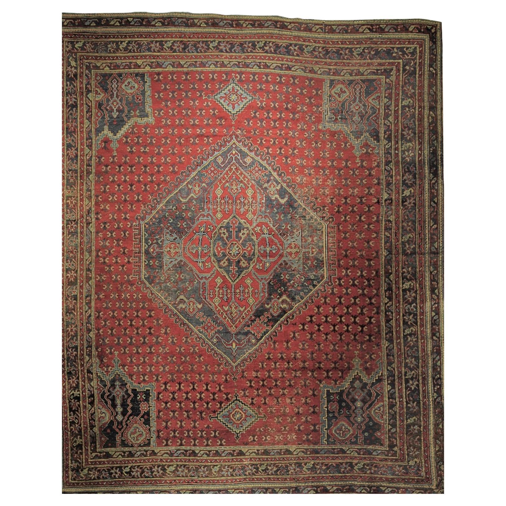 Grande tappeto Ushak fondo rosso con medaglione For Sale