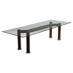 Large 1980s rectangular table with glass top and wooden base.