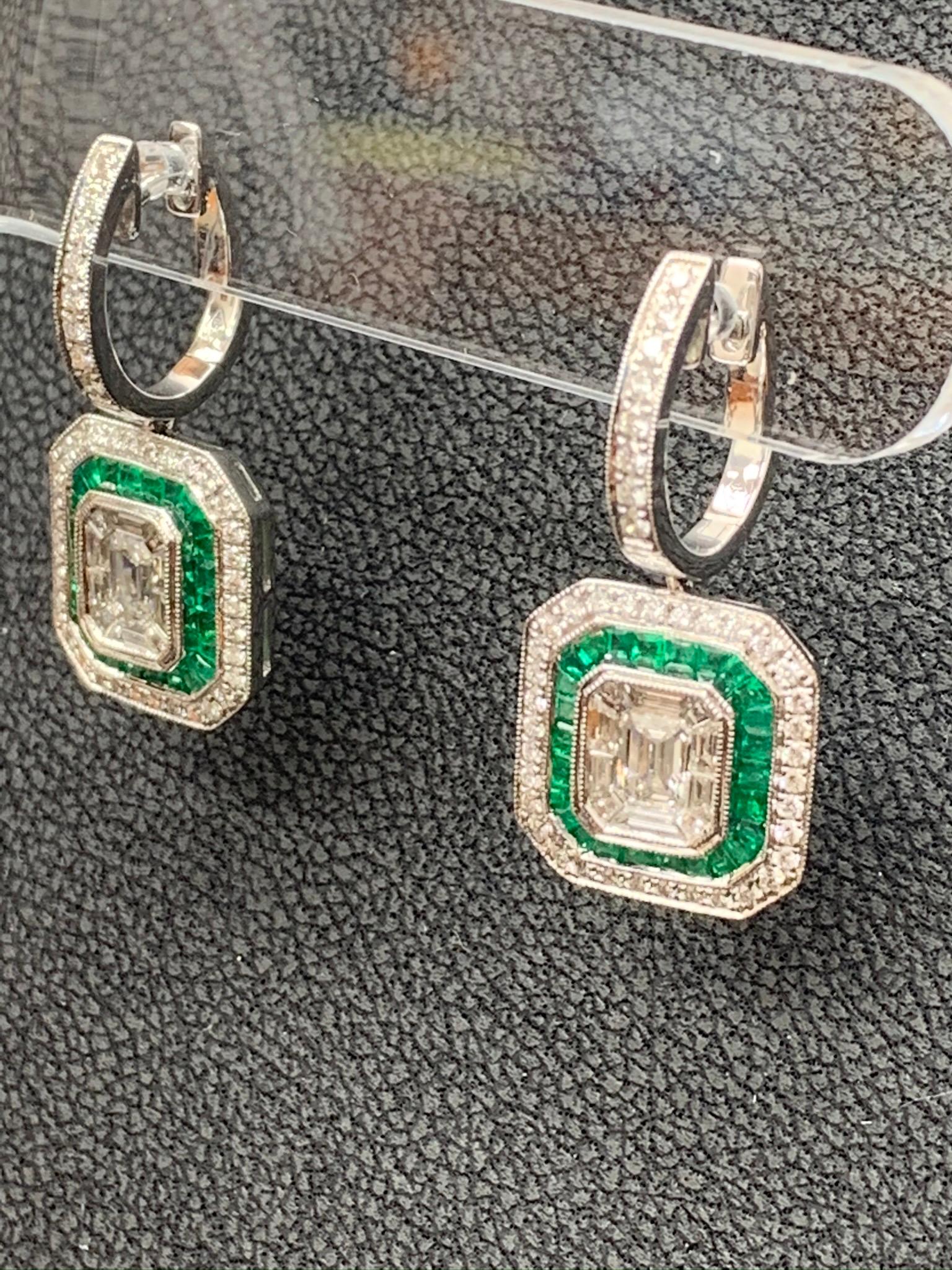 Women's 0.62 Carat Emerald Cut Diamond Emerald 18K White Gold Dangle Earrings For Sale