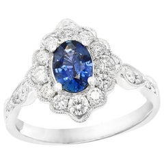 0.72 Carat Oval Shape Sapphire and Diamond 18K White Gold Ring