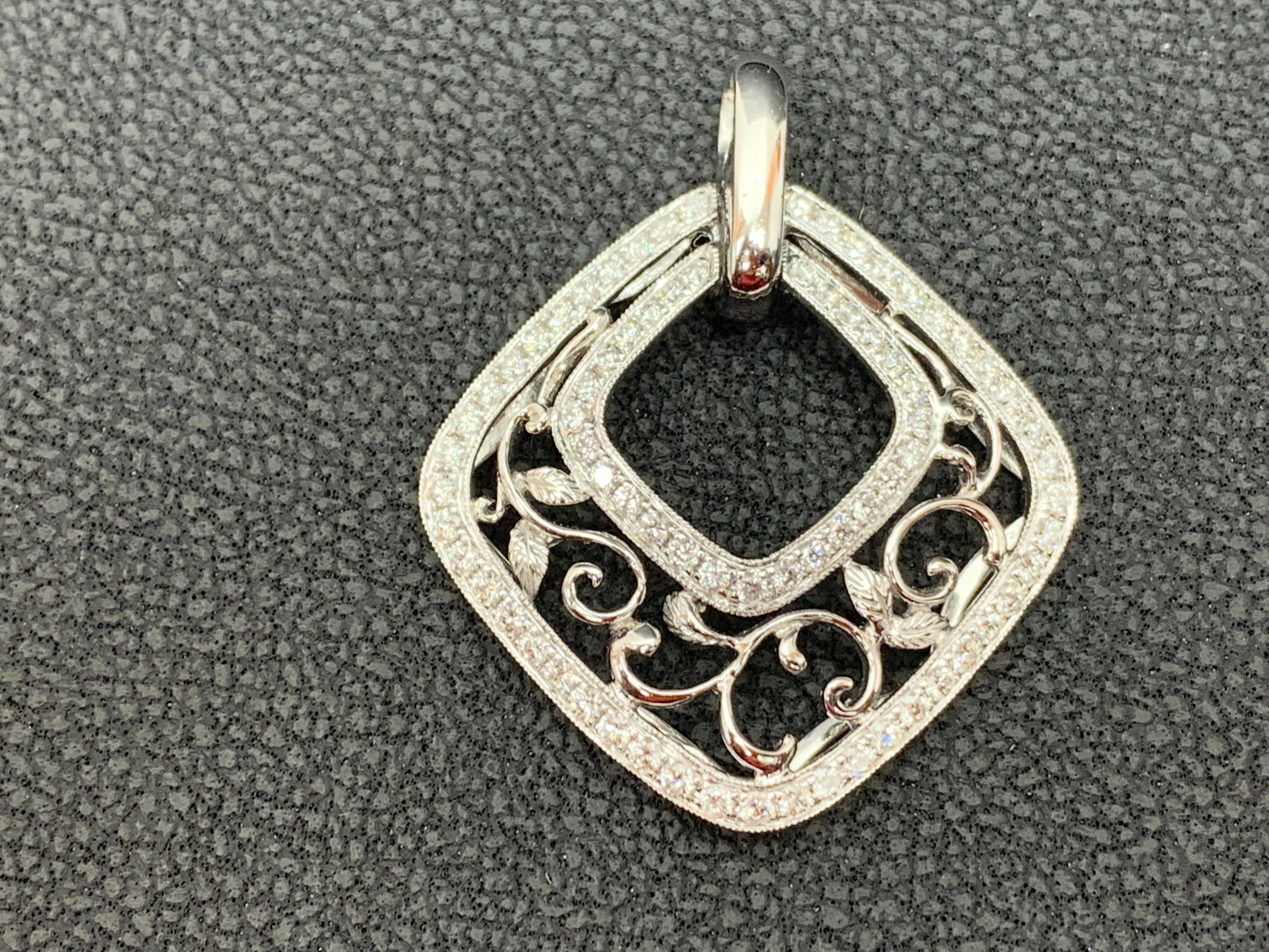 Showcases a Vintage style pendant of open-work design, encrusted by 74 round brilliant diamonds weighing 0.79 carats total. Pendant is in a three dimensional shape made in 18K White Gold.
18